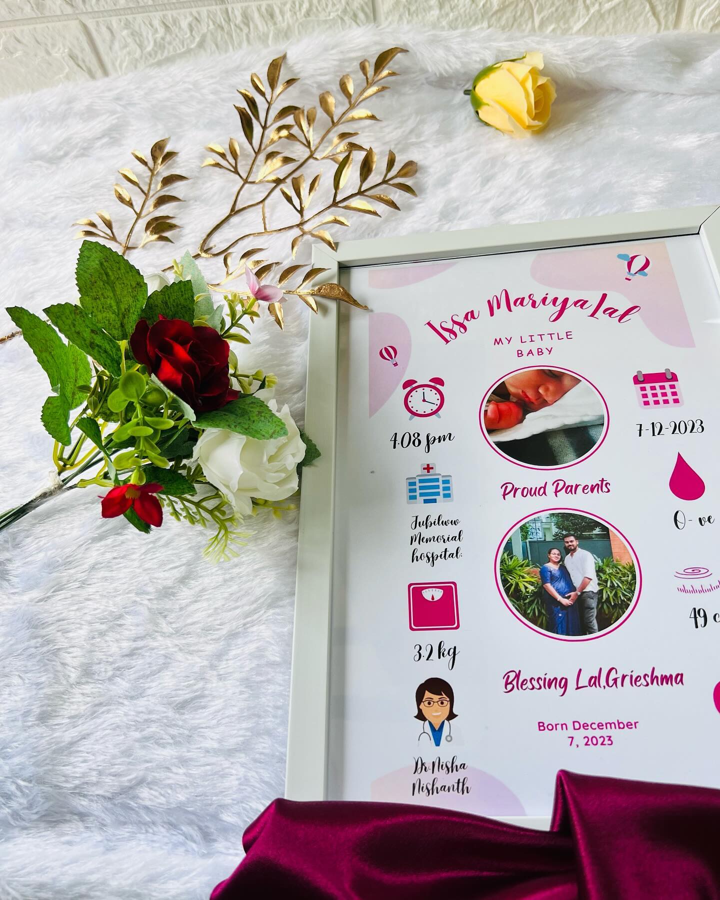 A personalized birth announcement frame detailing baby's name, birth stats and proud parents' photo.