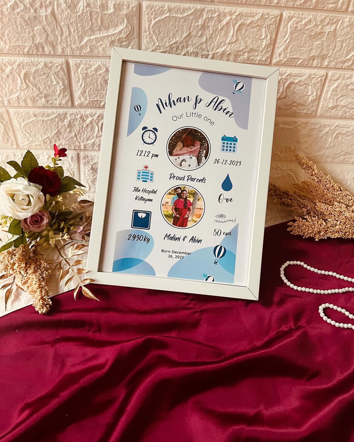 A soft blue personalized frame with baby and parents' photos, weight, time and birth date.