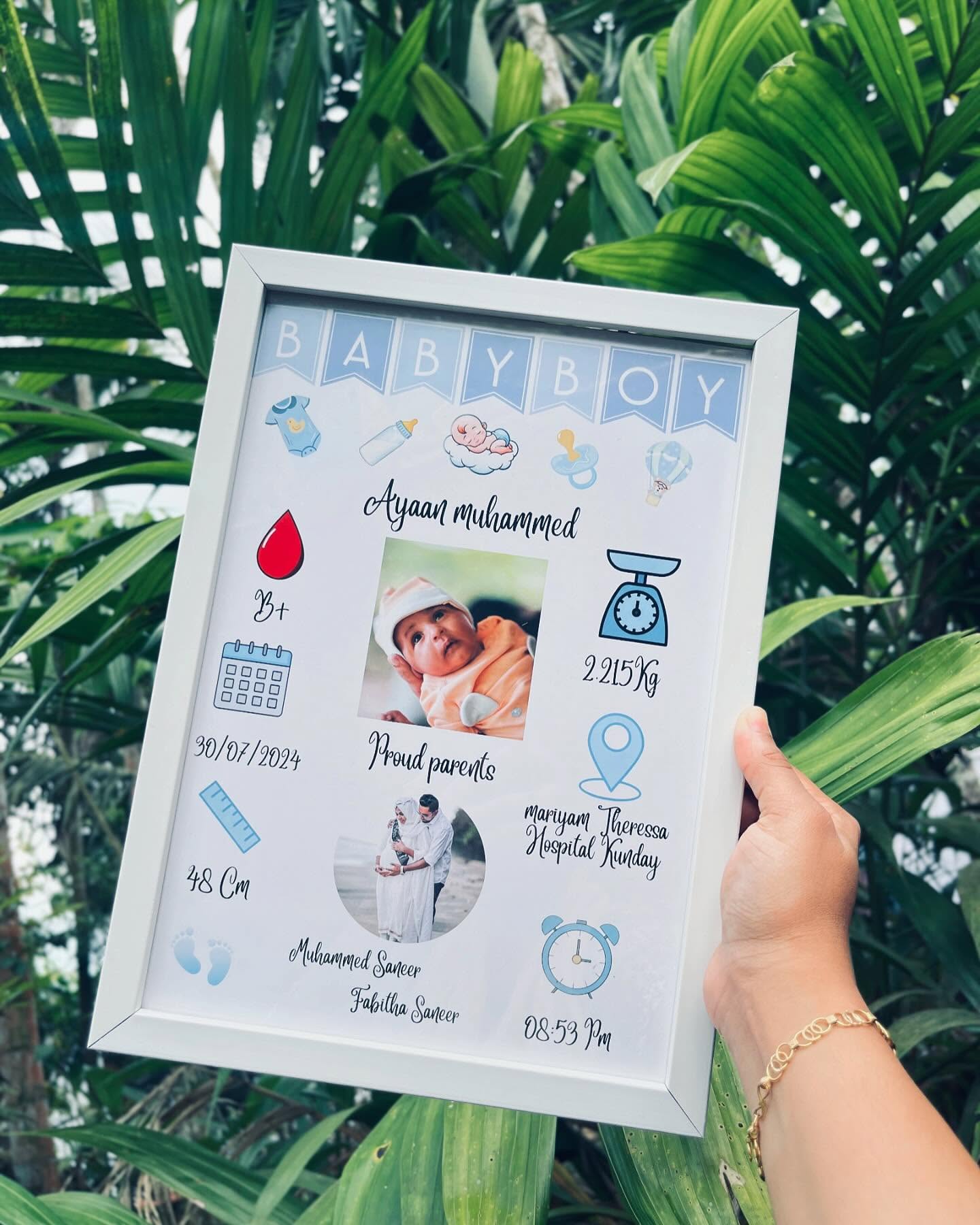 A personalized baby-boy milestone frame capturing name, weight, birth date and proud-parent photos in a soft blue keepsake design.