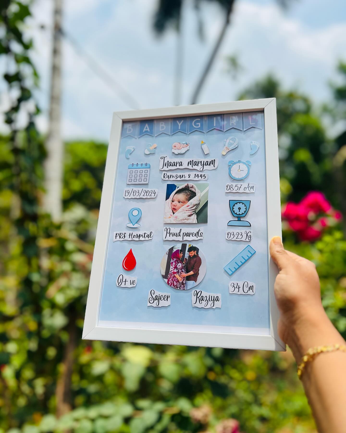 A custom framed birth announcement featuring the baby's name, photo, birth stats, and proud parents' details.