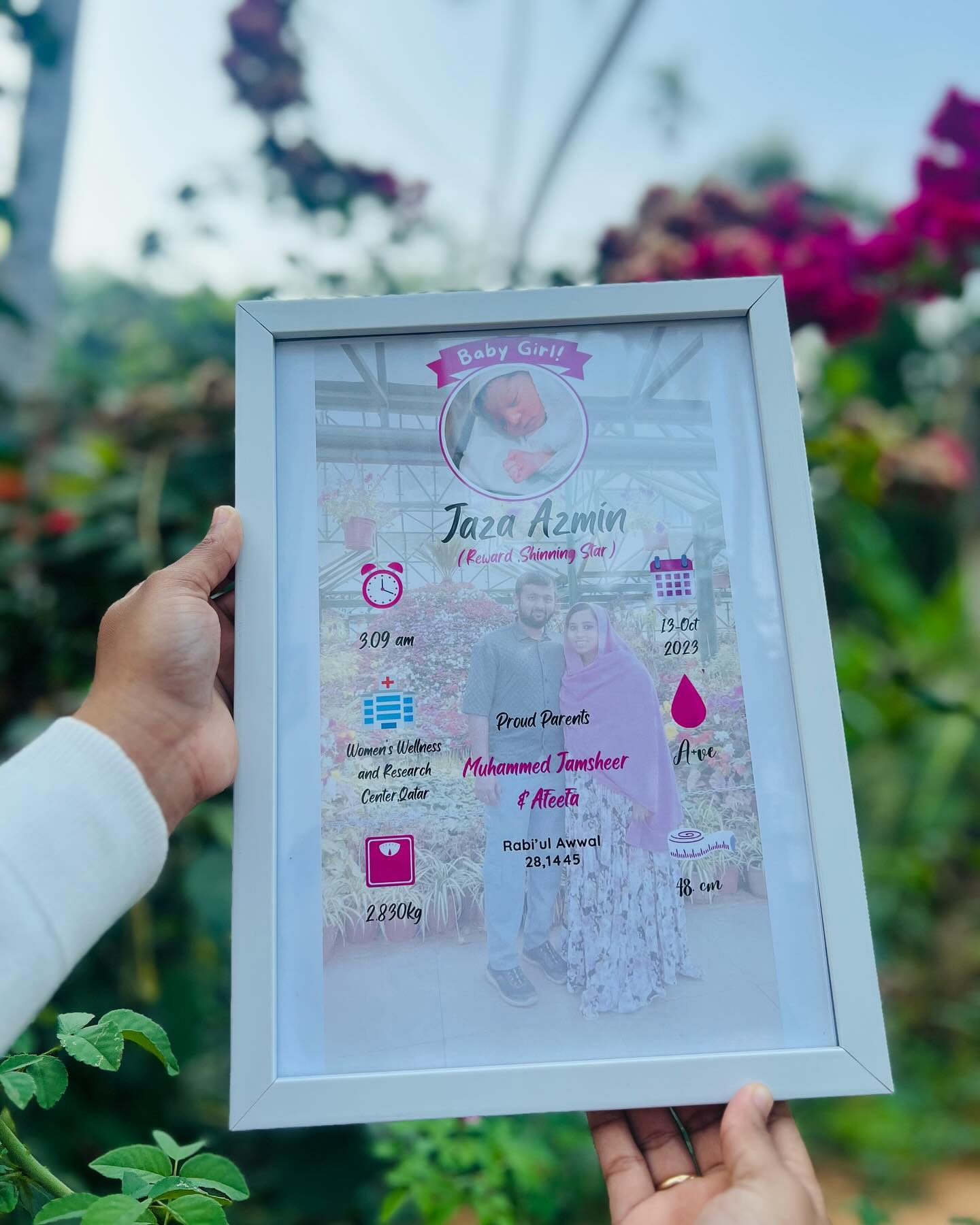A keepsake birth announcement frame celebrating a new baby girl with her name, stats, and a sweet family photo.