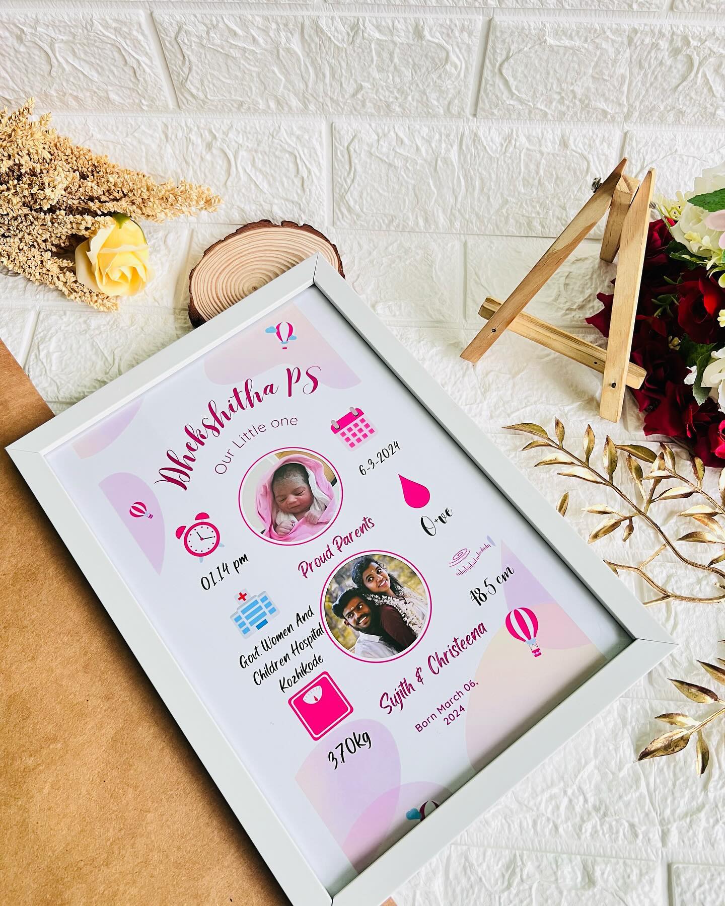 A pastel pink personalized frame showcasing your newborn daughter's name, birth date, and family photos.