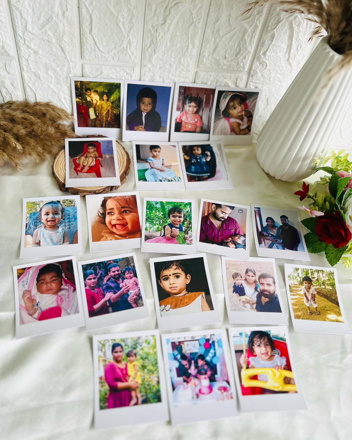 A large personalised set of instant-style photo prints tracing a little one's early milestones.
