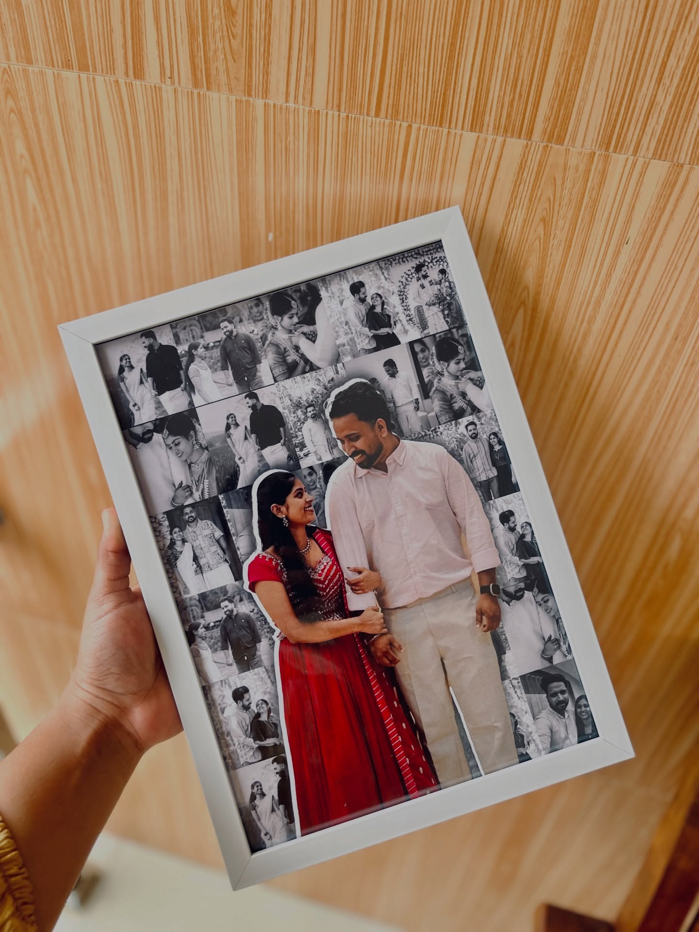 A large custom photo frame featuring a full-color couple cutout set against a black-and-white photo collage.