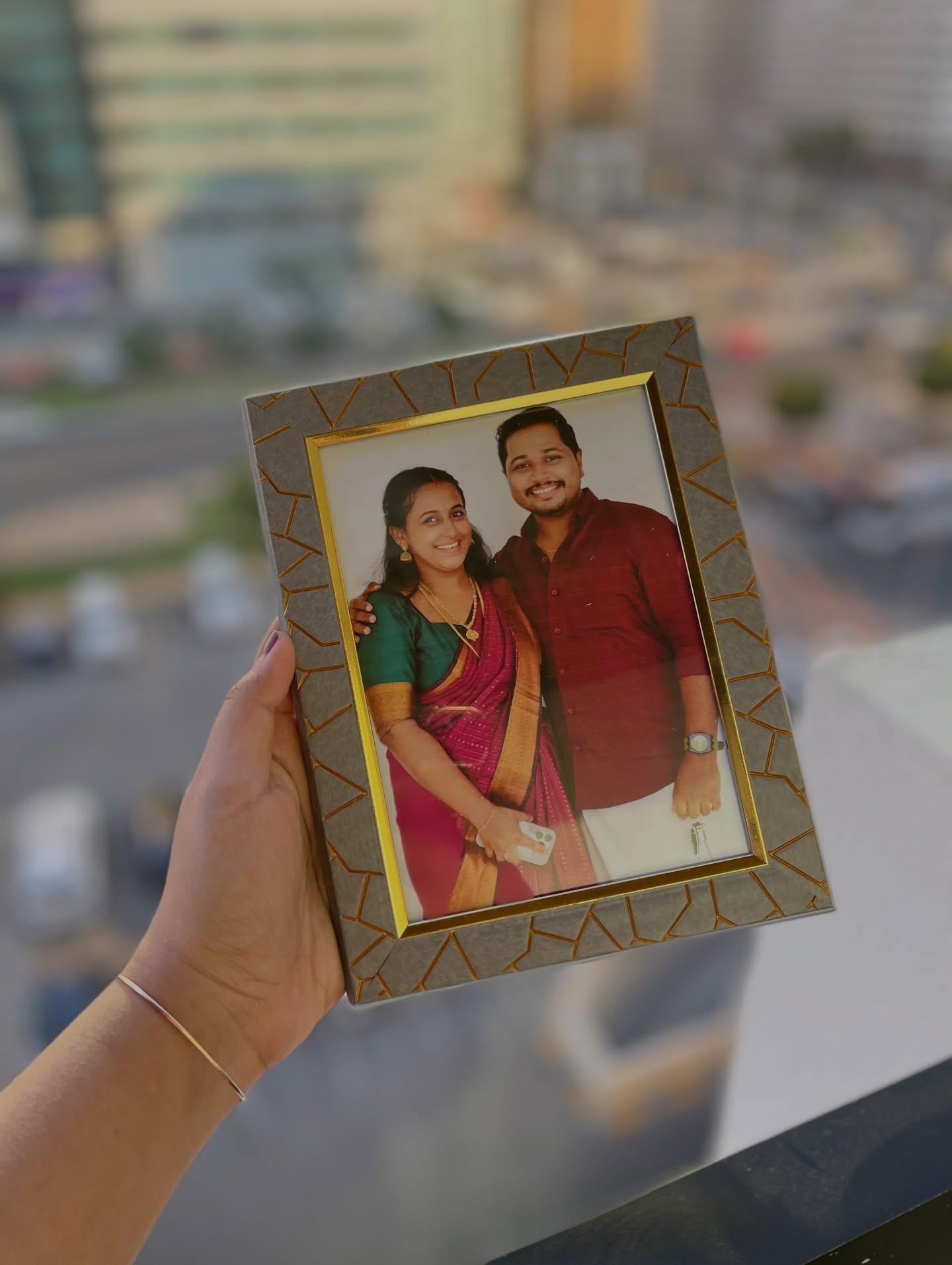 A cherished couple's portrait presented in a chic patterned photo frame, perfect as a personal keepsake gift.