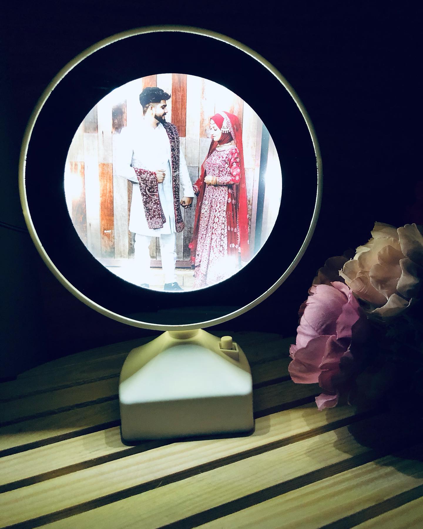 A glowing personalized photo lamp featuring your favourite couple portrait, paired with a soft blush rose bouquet.