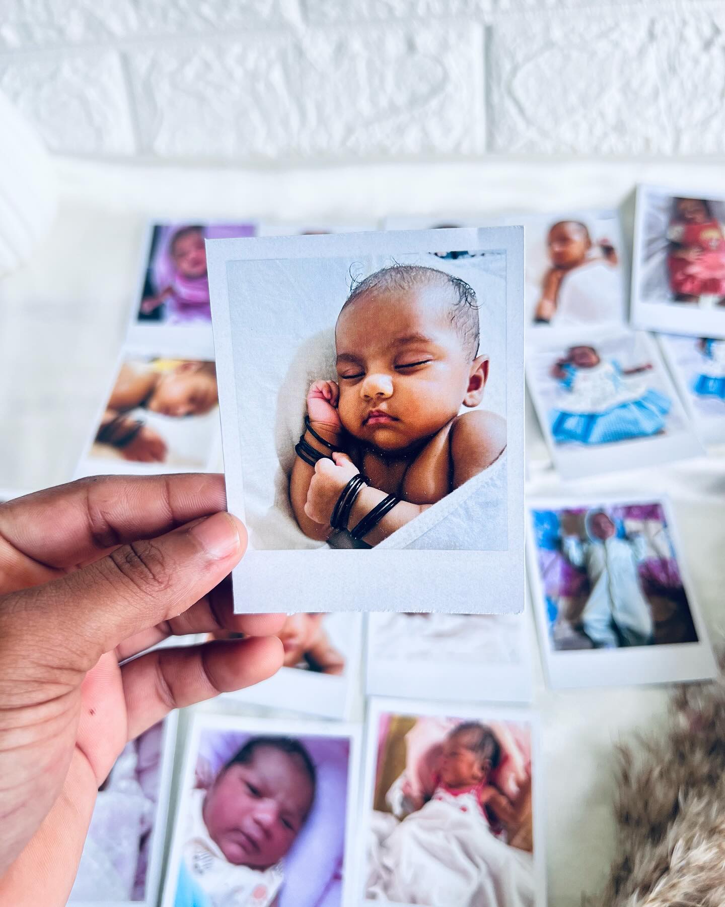 A set of instant-style polaroid prints capturing your baby's most precious early moments.