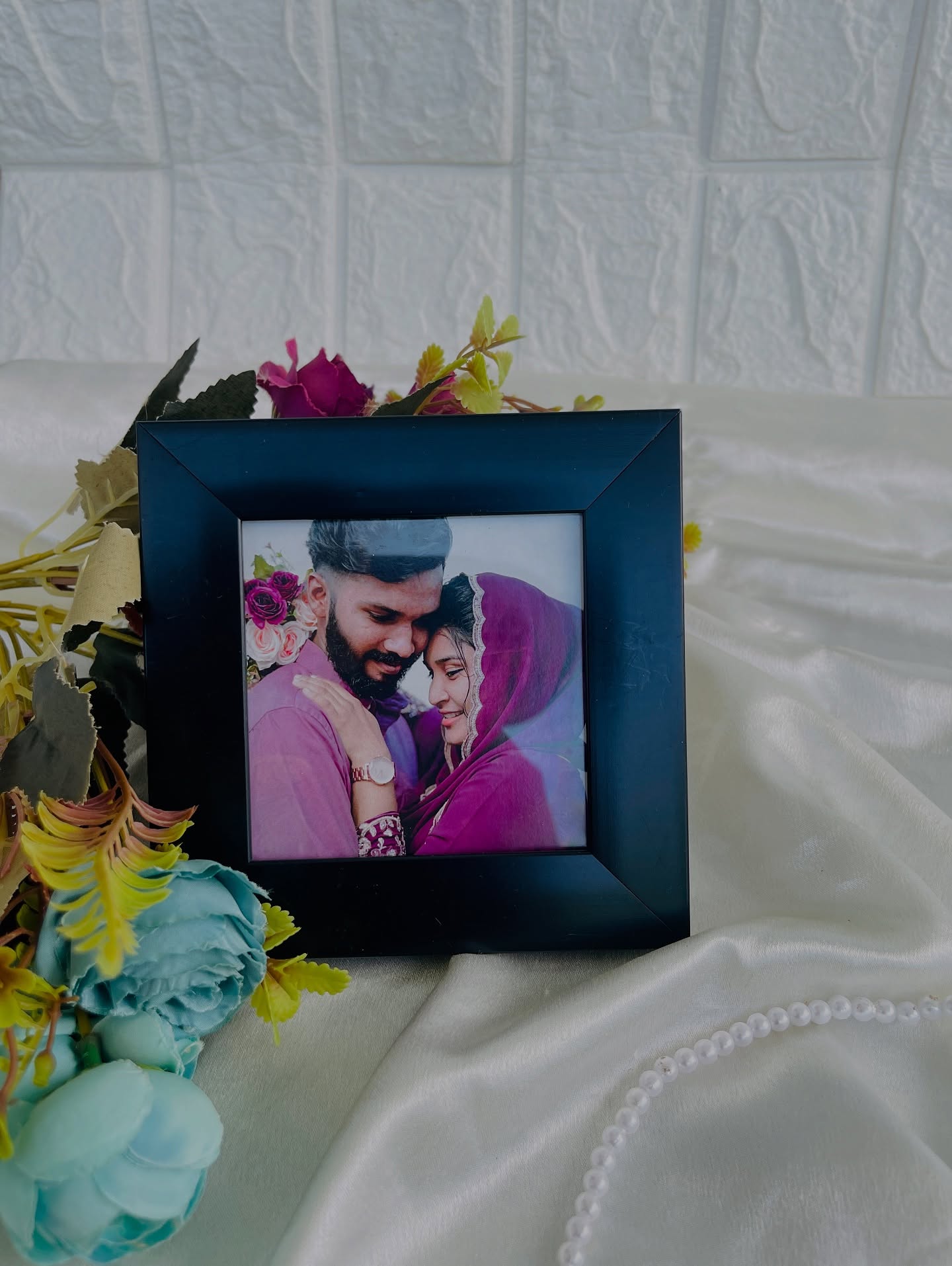 A simple navy wooden photo frame personalized with your favorite couple portrait.