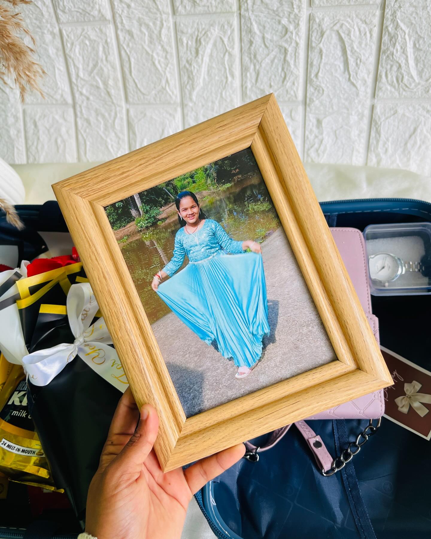 A warm wooden photo frame personalized with a treasured picture, ready to display anywhere.