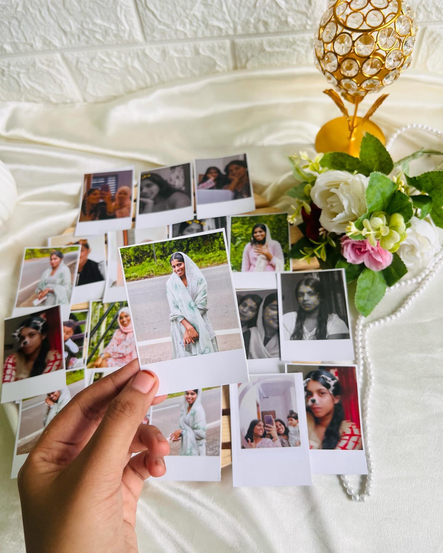 A fanned-out set of personalised instant-style photo prints capturing favourite memories.