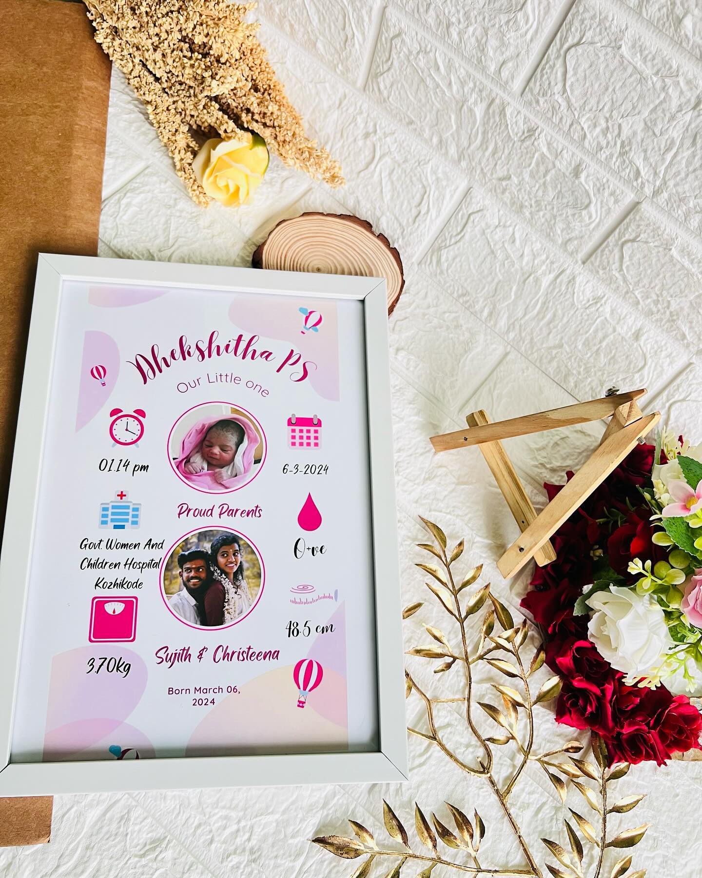 A personalized birth announcement frame featuring baby and parent photos with all the newborn details.