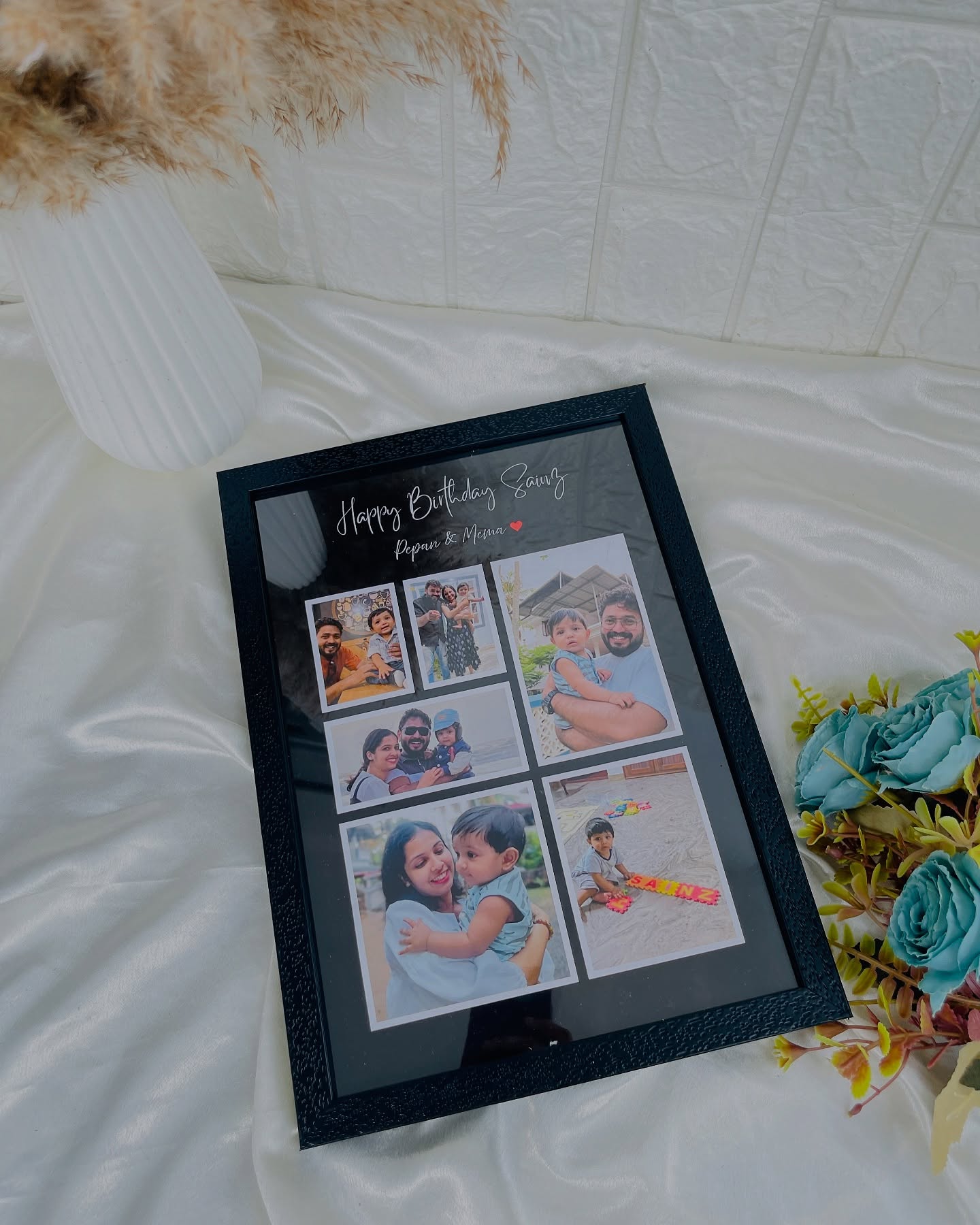 A personalized black photo collage frame filled with family snapshots and a custom birthday message.