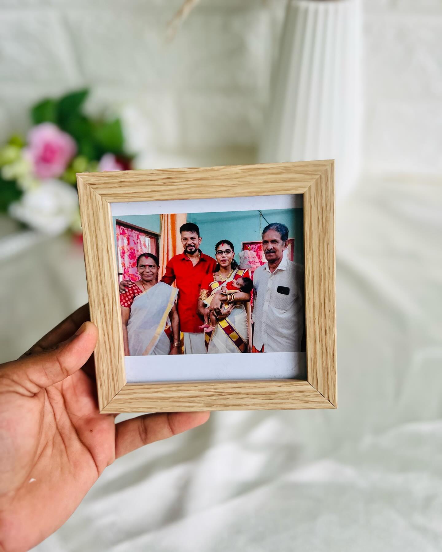 A warm wood-toned frame personalized with a treasured family photograph.