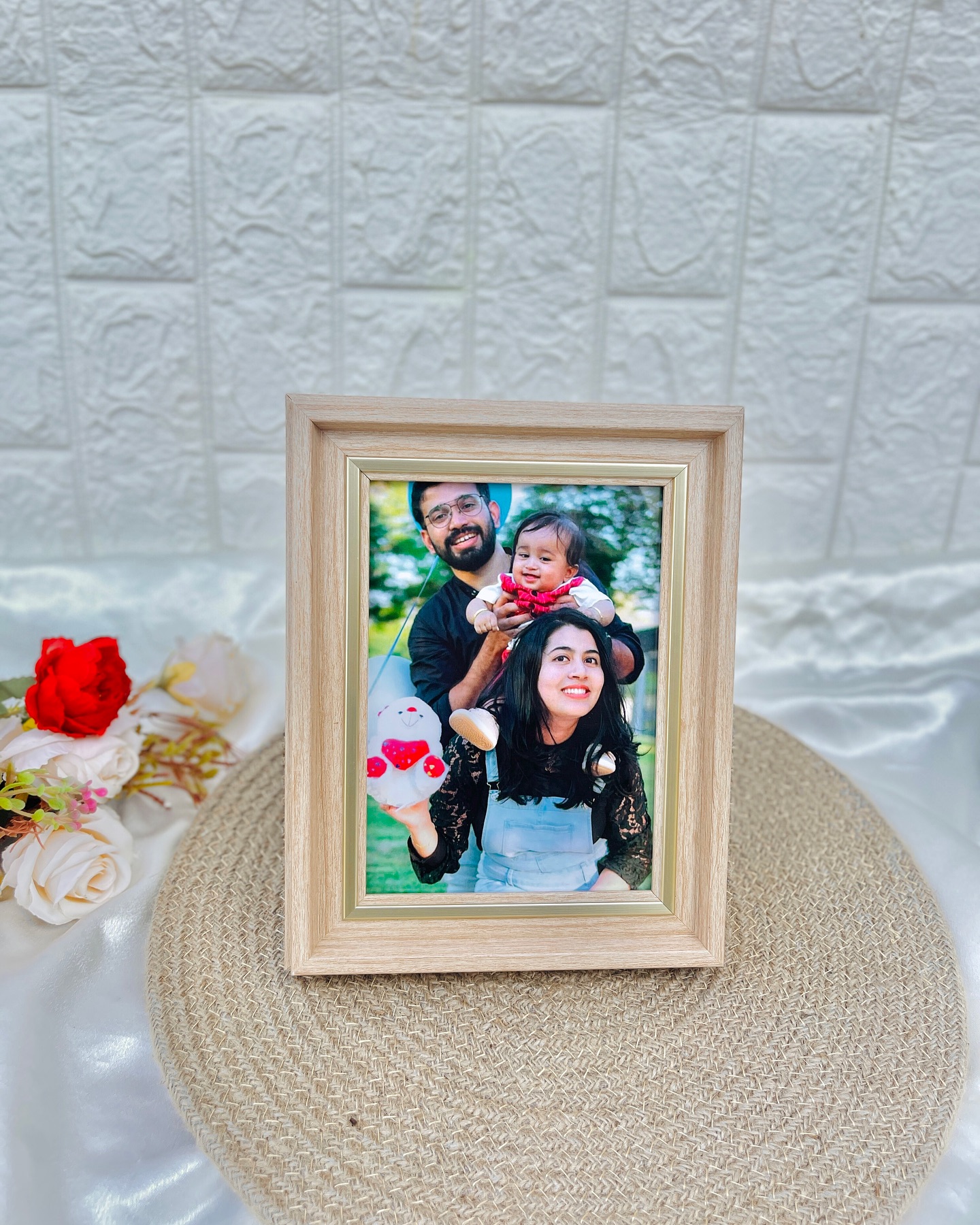 A wooden-finish photo frame personalized with a cherished family photograph.