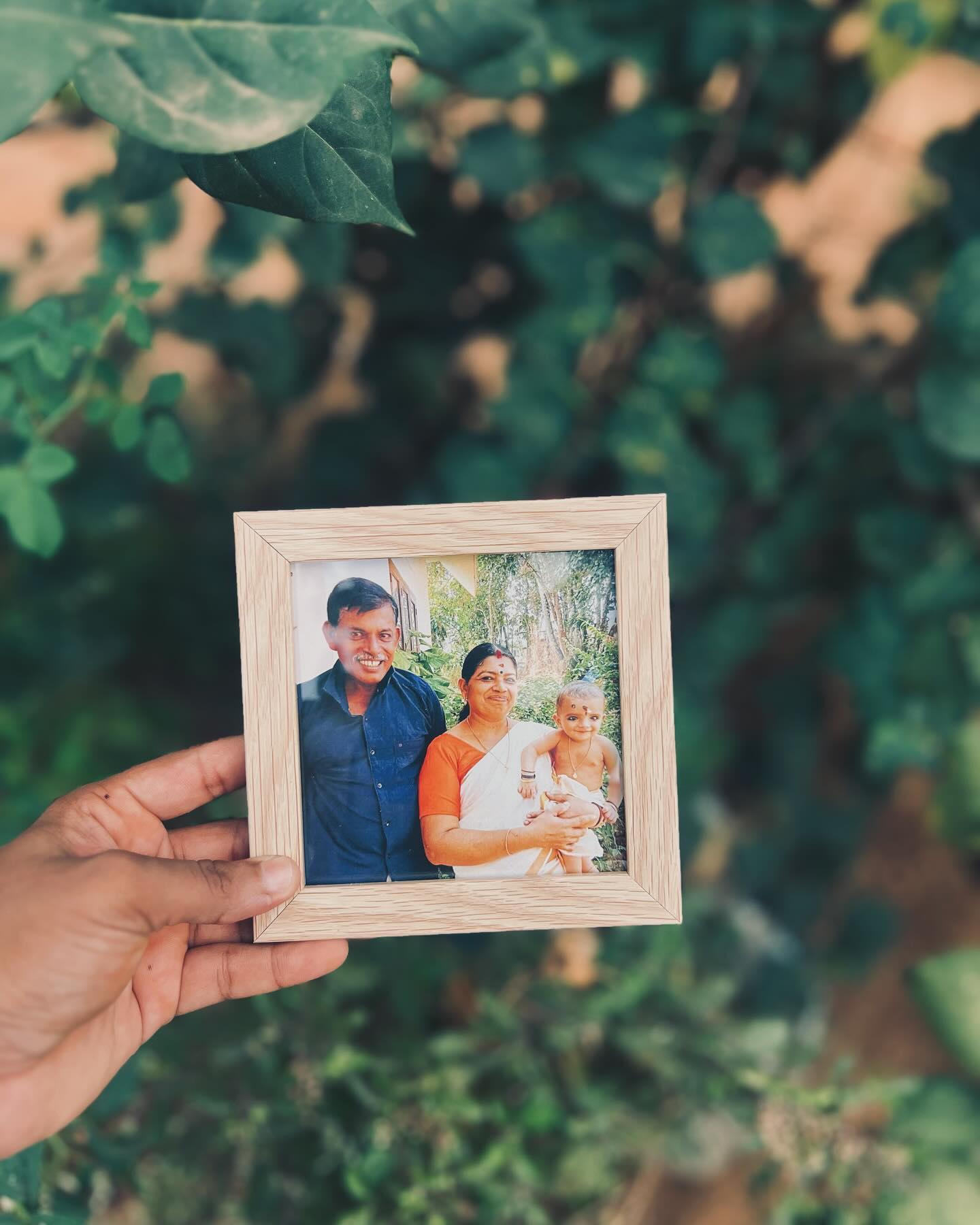 A timeless wooden photo frame capturing a treasured family moment.