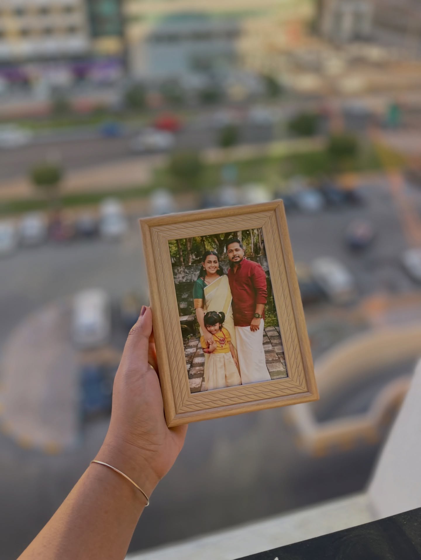 A warm wooden photo frame personalized with a treasured family portrait.