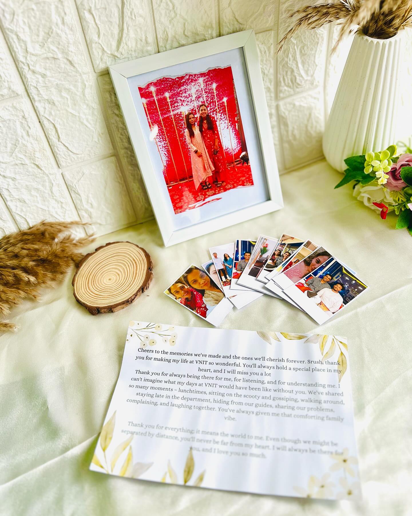 A framed photo, a set of polaroid prints and a printed keepsake letter, bundled as a heartfelt farewell or friendship gift.