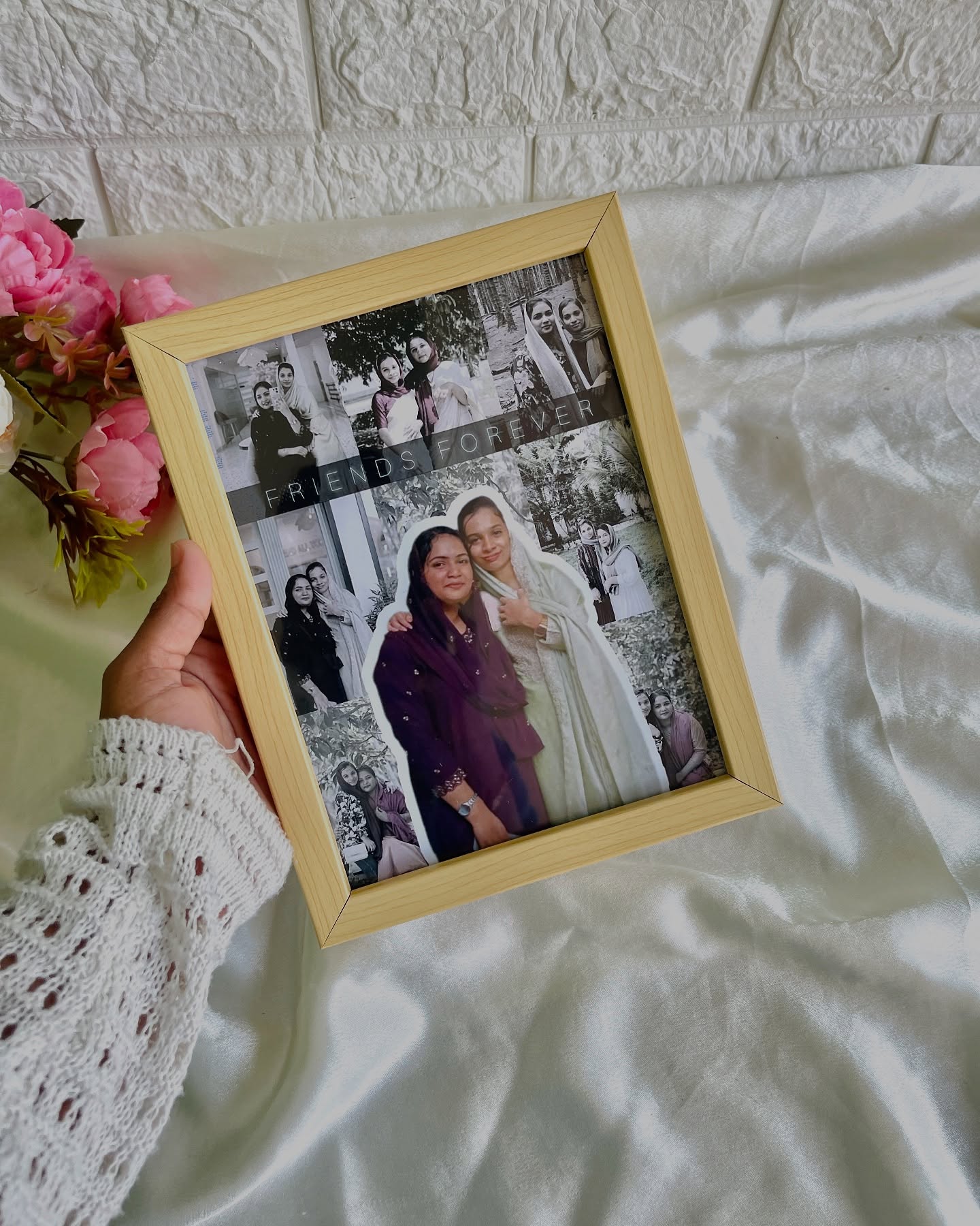 A wood-toned frame filled with a black-and-white photo collage and a die-cut friendship portrait, captioned "Friends Forever."