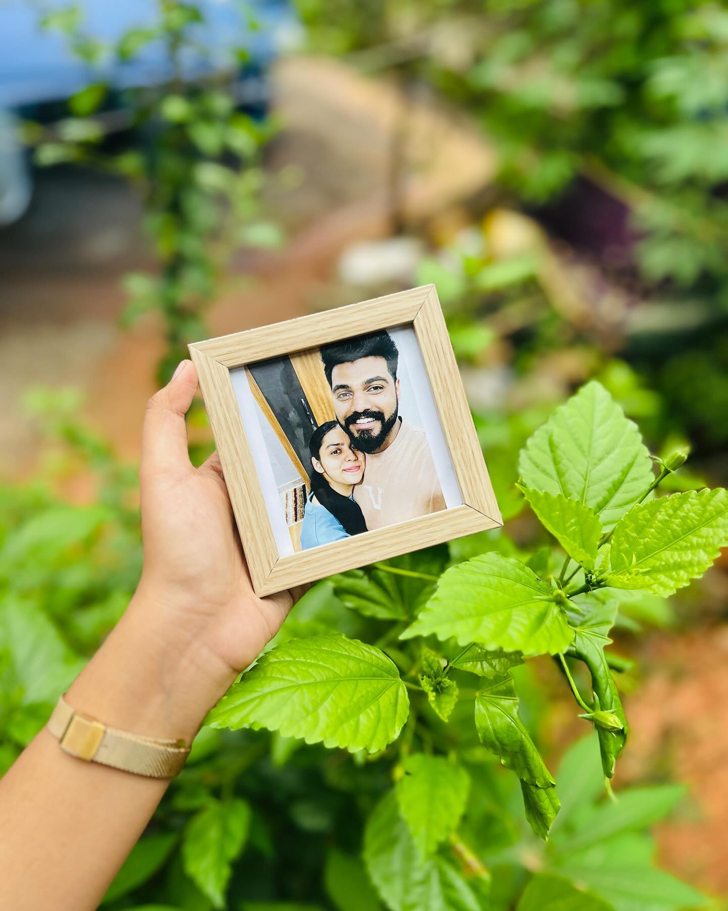 A compact wooden photo frame capturing a candid couple selfie, perfect as a small everyday keepsake.