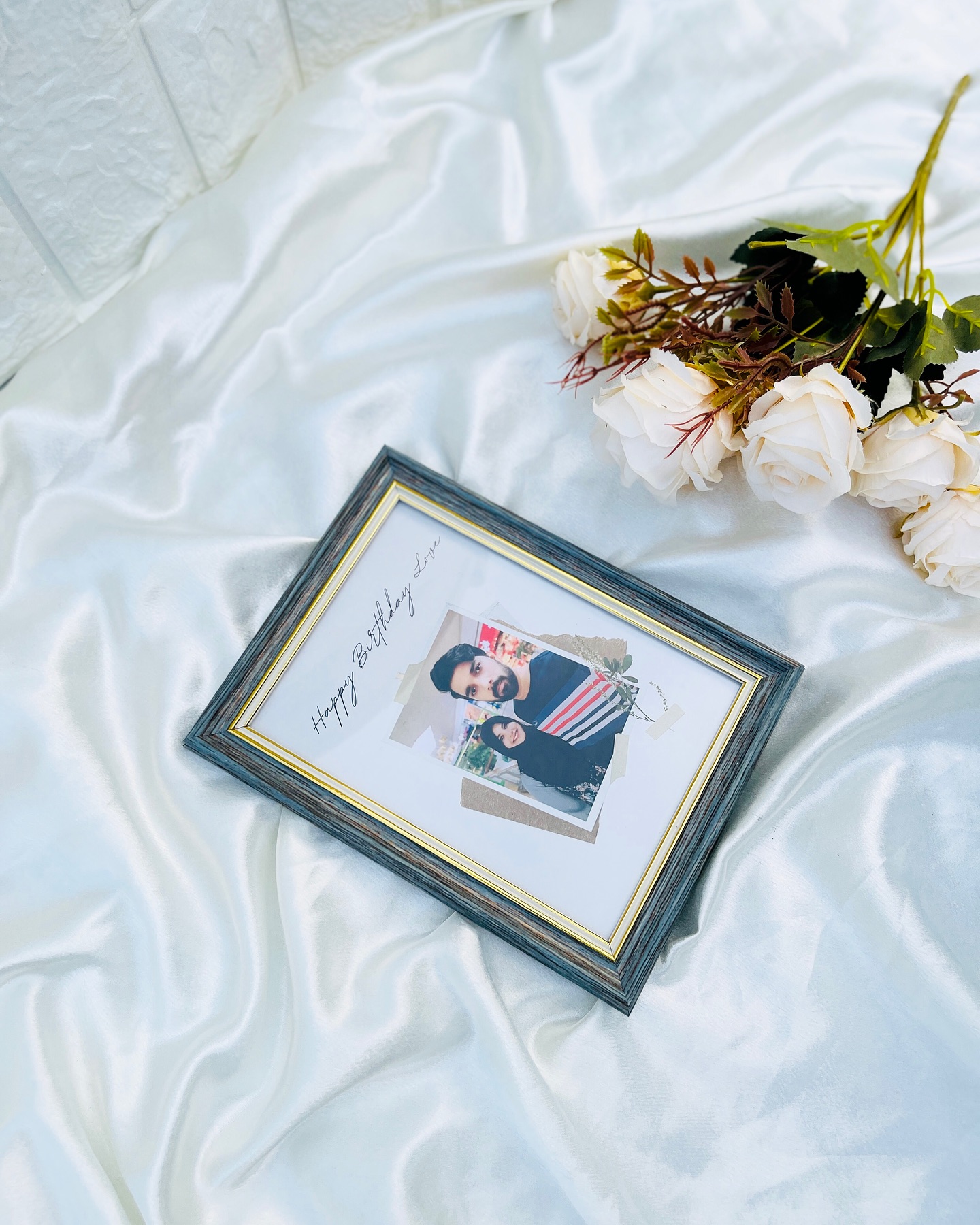 A rustic wood-toned frame with a personalized couple photo and a handwritten 'Happy Birthday Love' message.