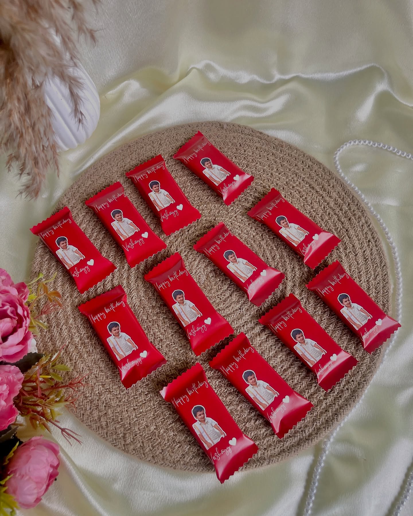 A set of personalized chocolate bars printed with a birthday photo and message.