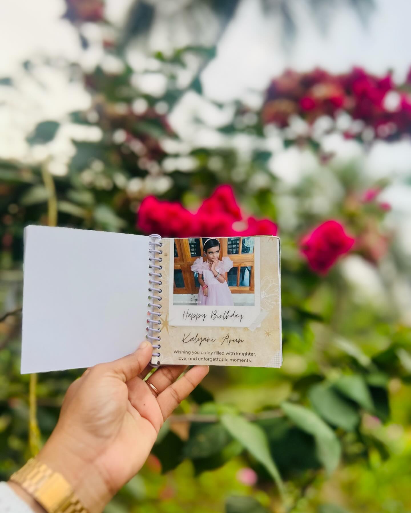 A spiral-bound personalized flip book featuring a favourite photo and a heartfelt birthday message.