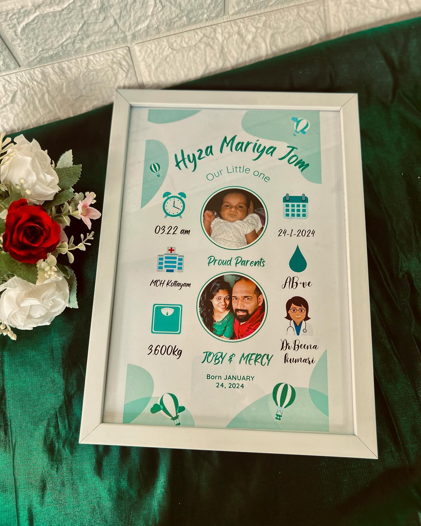 A pastel-teal personalized frame capturing your newborn's name, birth details, and the proud parents' photo.