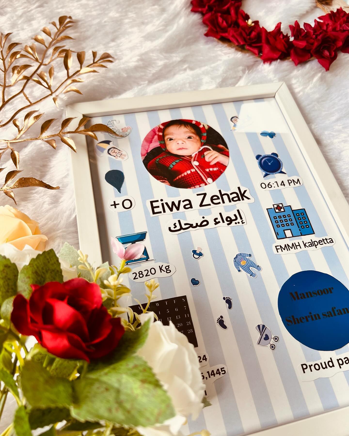 A blue-striped personalized frame recording baby's photo, name, weight, birth time and hospital details.