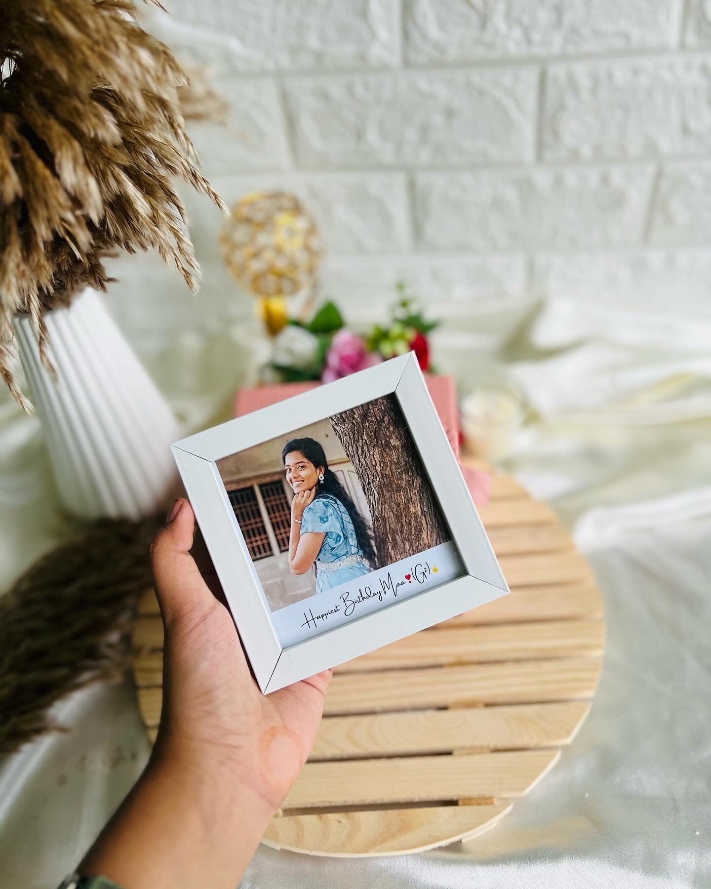 A compact frame printed with a cherished photo and a warm "Happiest Birthday Maa" message.