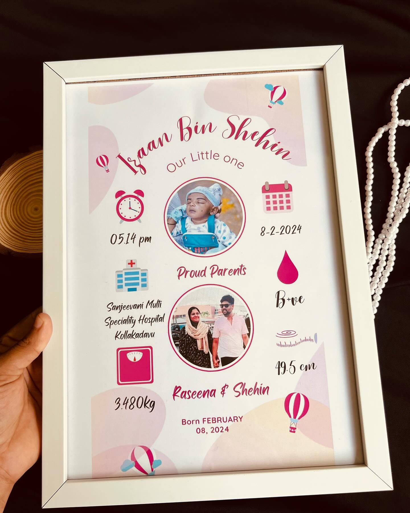 A personalized framed birth announcement poster capturing baby's name, stats, and proud parents' photo.