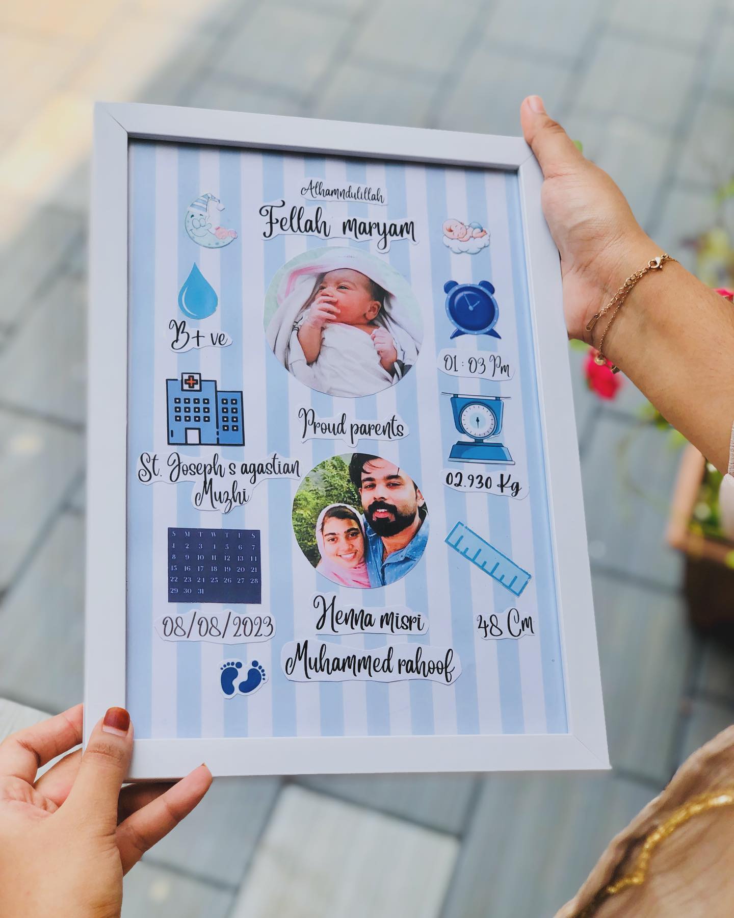 A personalized keepsake frame recording baby's name, photo, birth date, weight and the proud parents' picture.