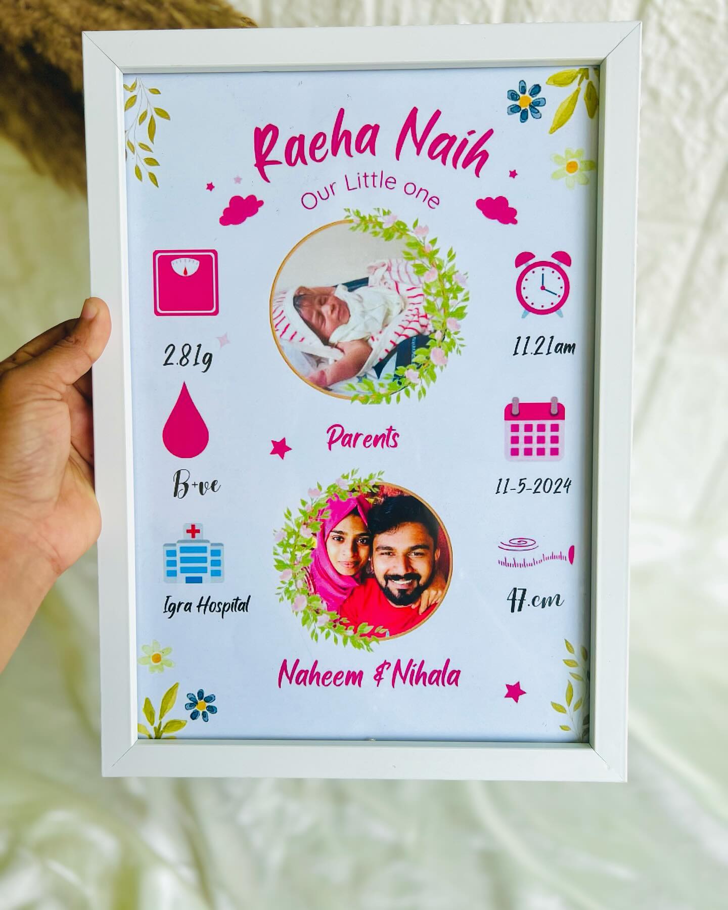 A framed birth-details keepsake with the baby's photo, parents' photo, weight, time and hospital, ready to personalize.