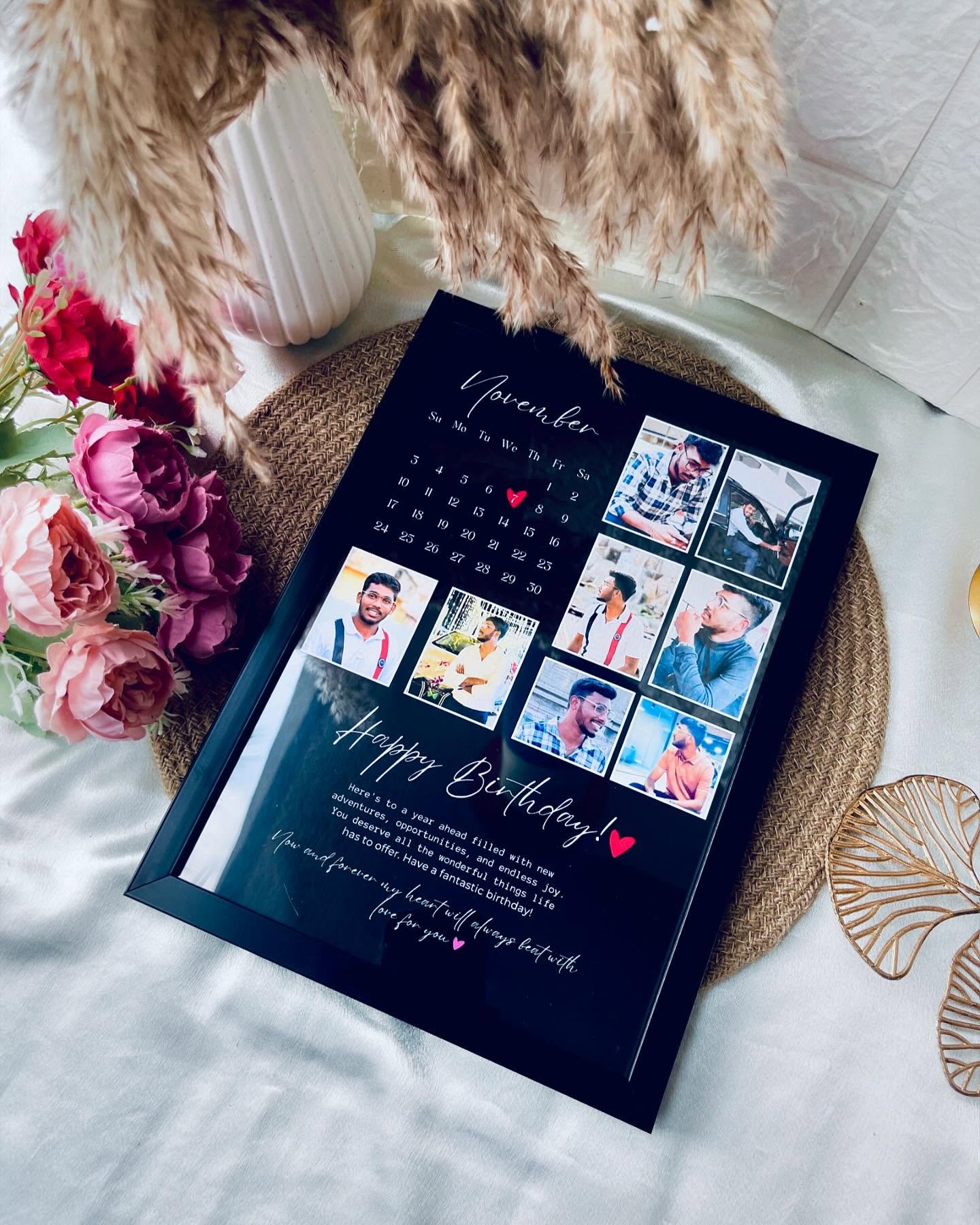 A black acrylic photo collage frame styled as a November calendar with six photos and a birthday message.