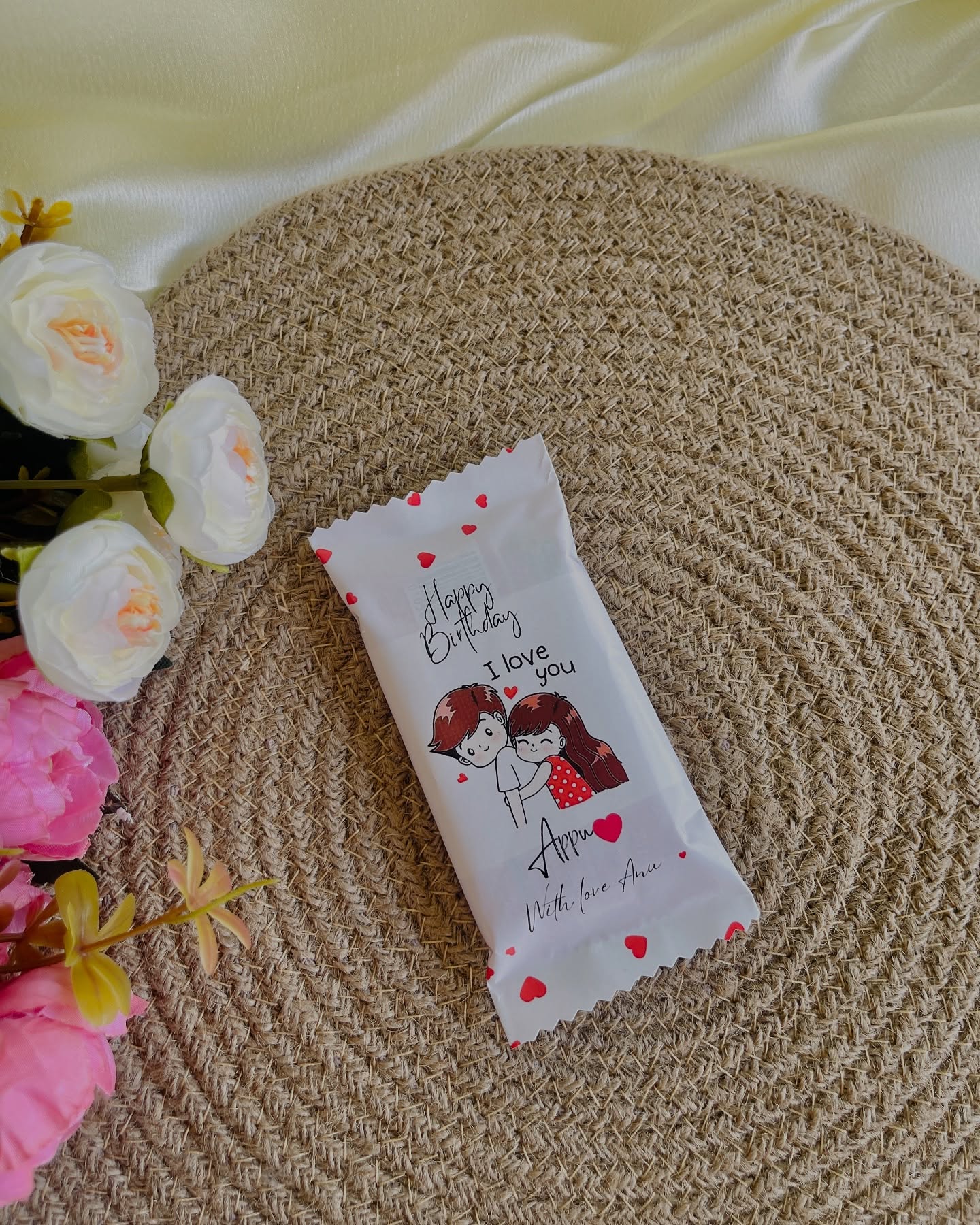 A single chocolate bar wrapped in a custom-printed sleeve with your own birthday message and names.