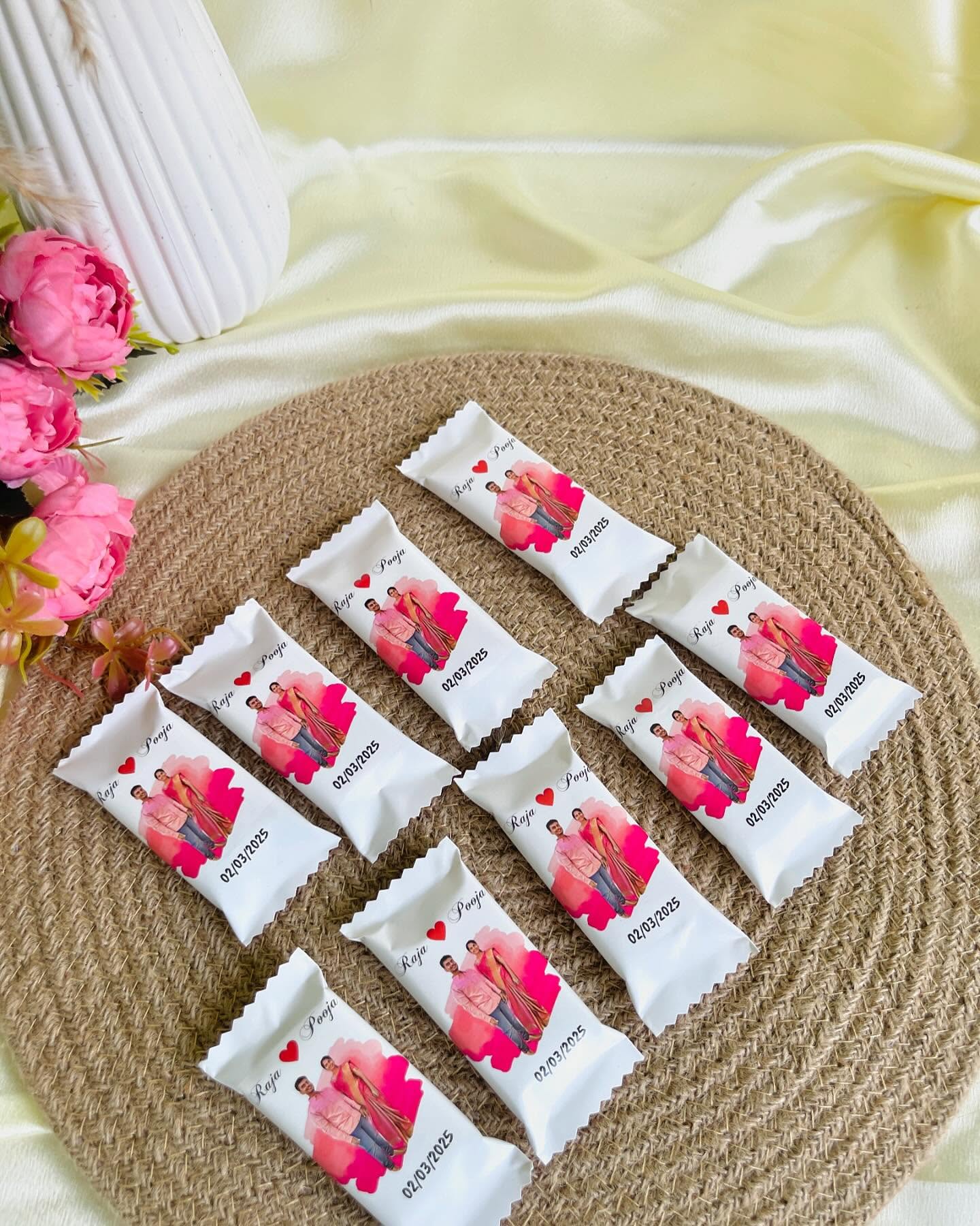 Custom-wrapped chocolate bars printed with a couple's photo, names, and special date.