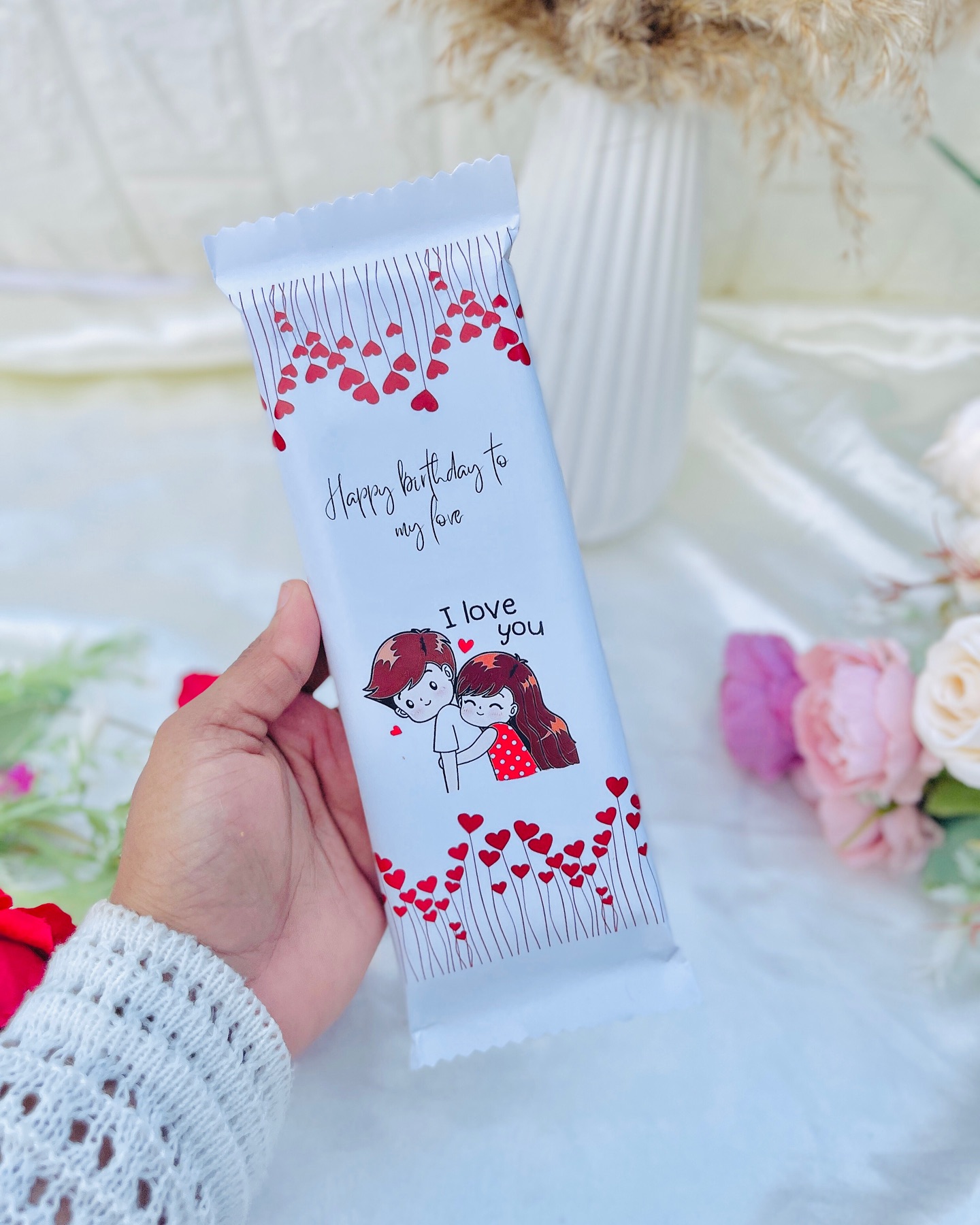 A single custom-wrapped chocolate bar printed with a romantic "Happy birthday to my love, I love you" design.