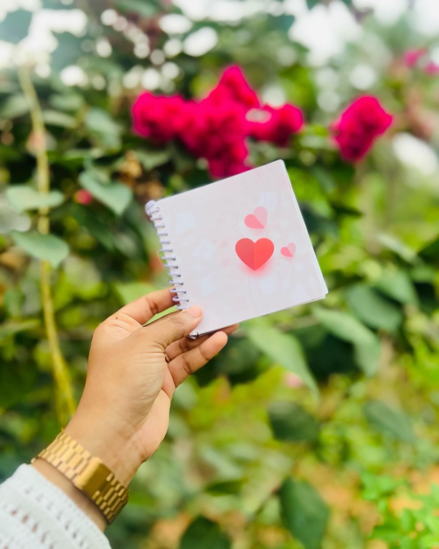 A spiral-bound photo book with a named, dated page and a heartfelt keepsake message.