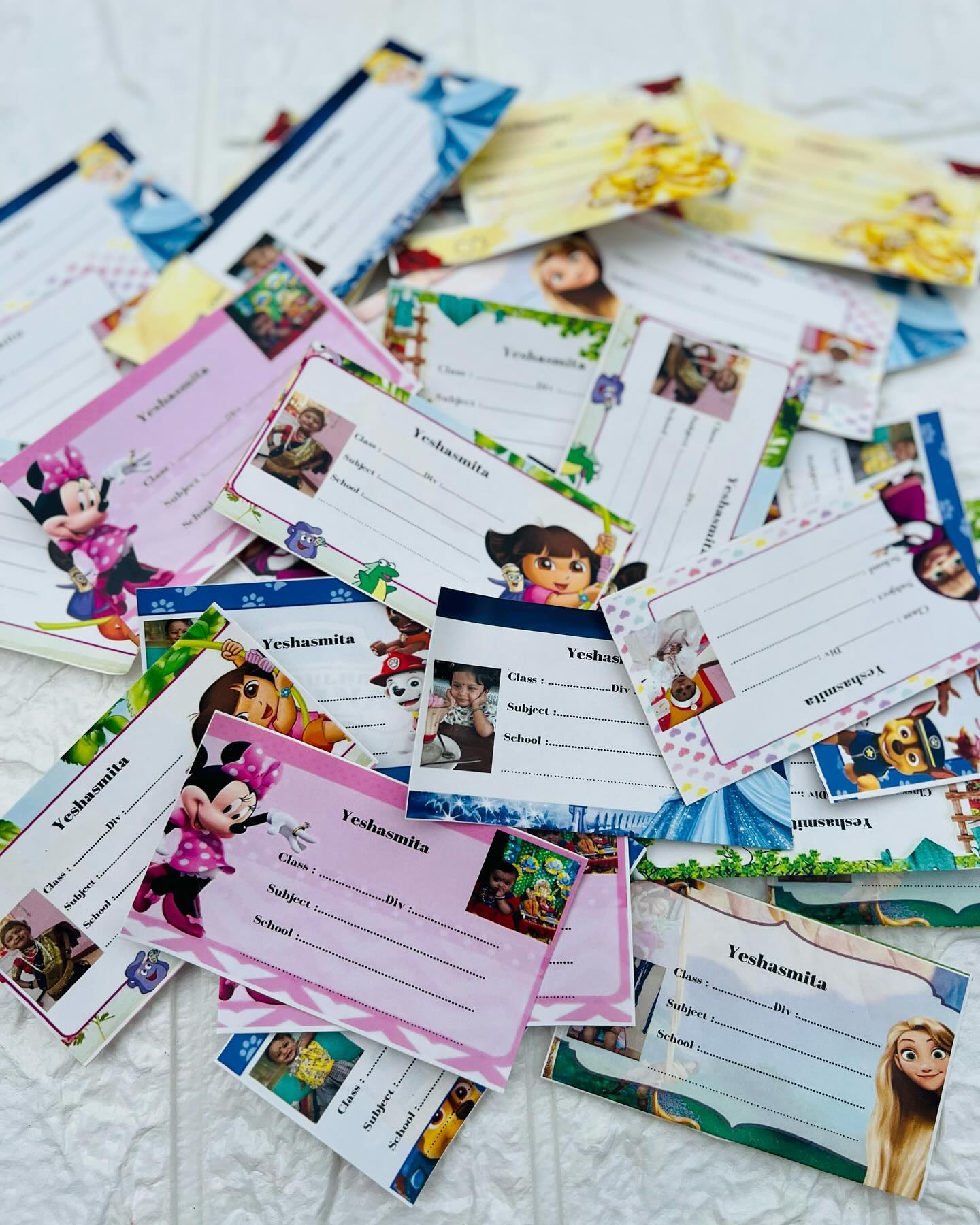A colourful set of custom name and photo labels, perfect for school books and belongings.