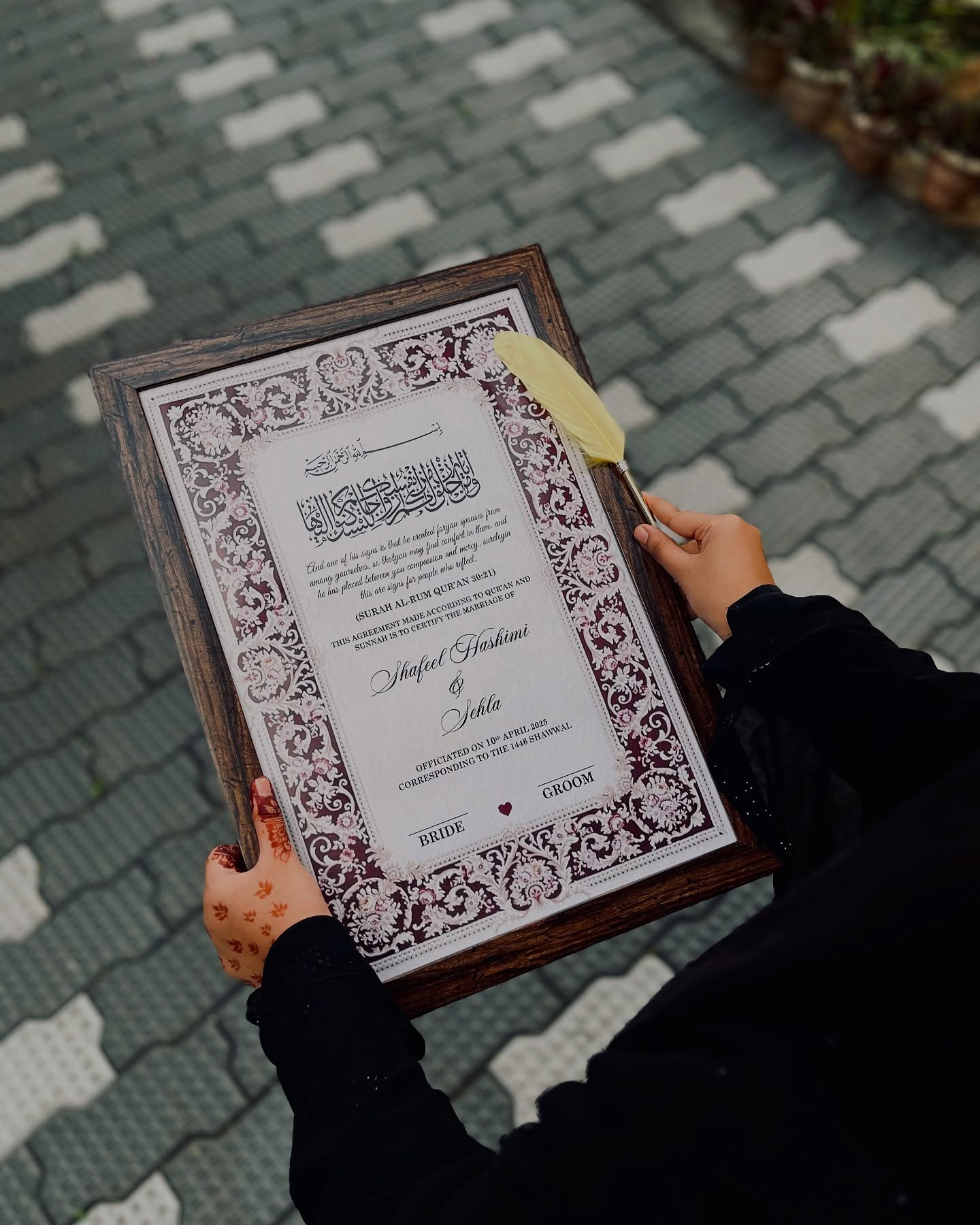 A framed, custom-printed Nikah certificate personalized with the couple's names and wedding date.