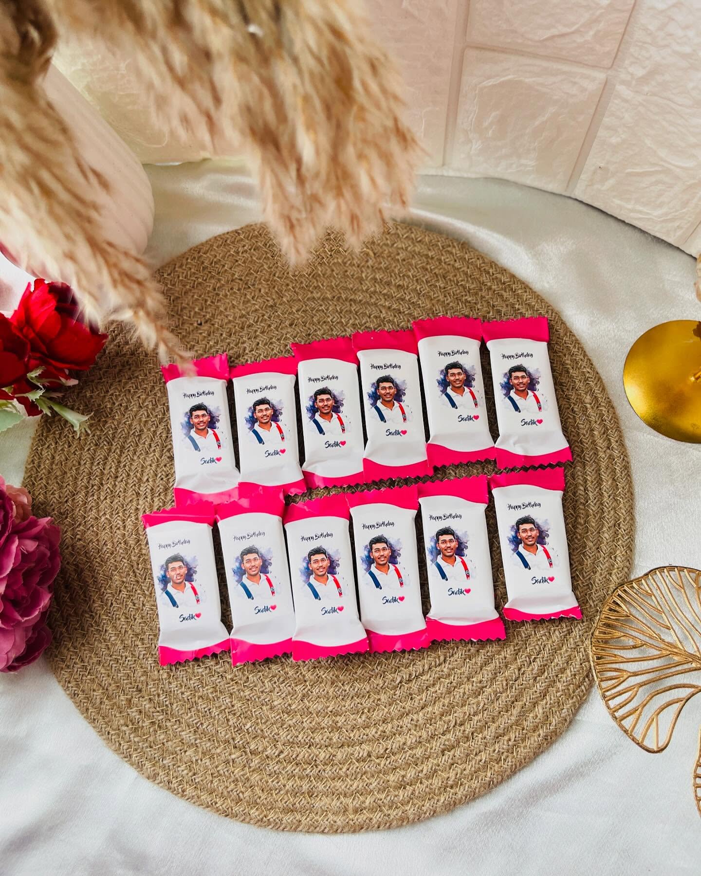A set of twelve custom-wrapped chocolate bars printed with his photo and a birthday message.