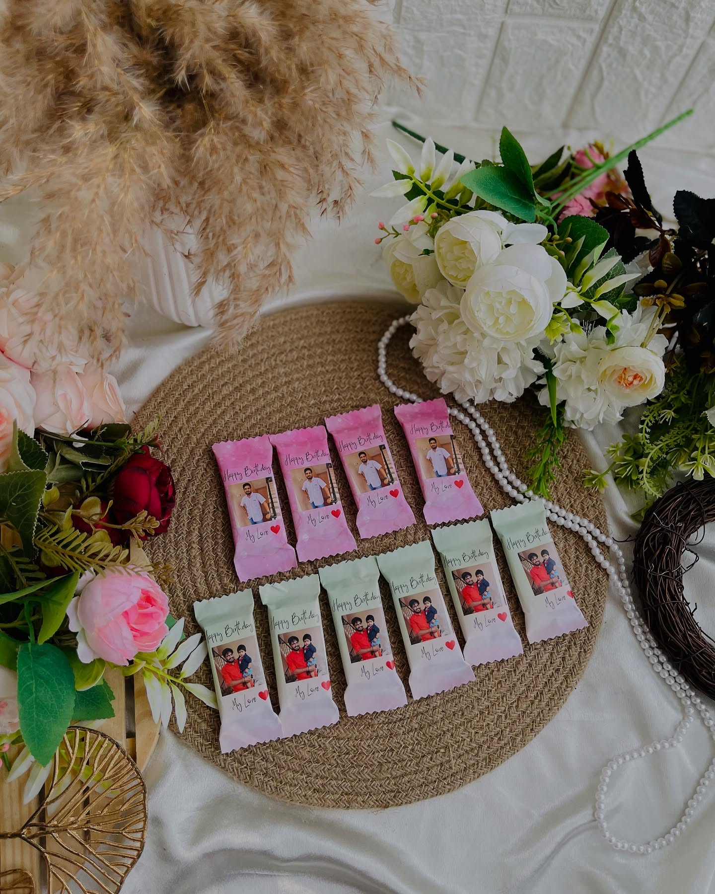 A set of photo-wrapped chocolate bars featuring family pictures and a Happy Birthday message.