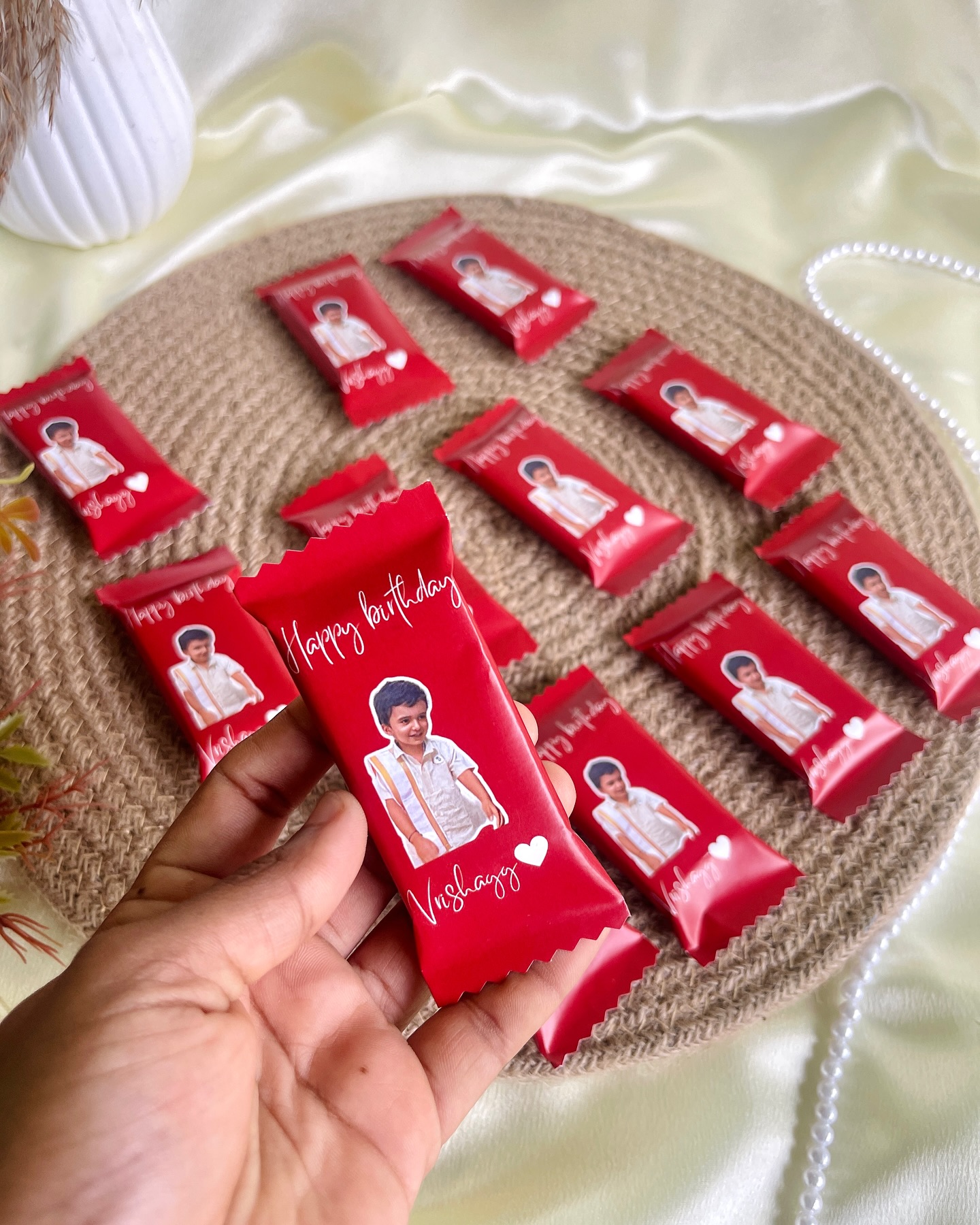 A set of individually wrapped chocolate bars printed with a custom photo and birthday message.