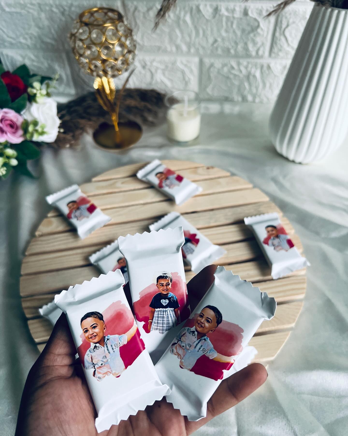 A set of mini chocolate bars individually wrapped with custom printed photos, perfect as party favors.