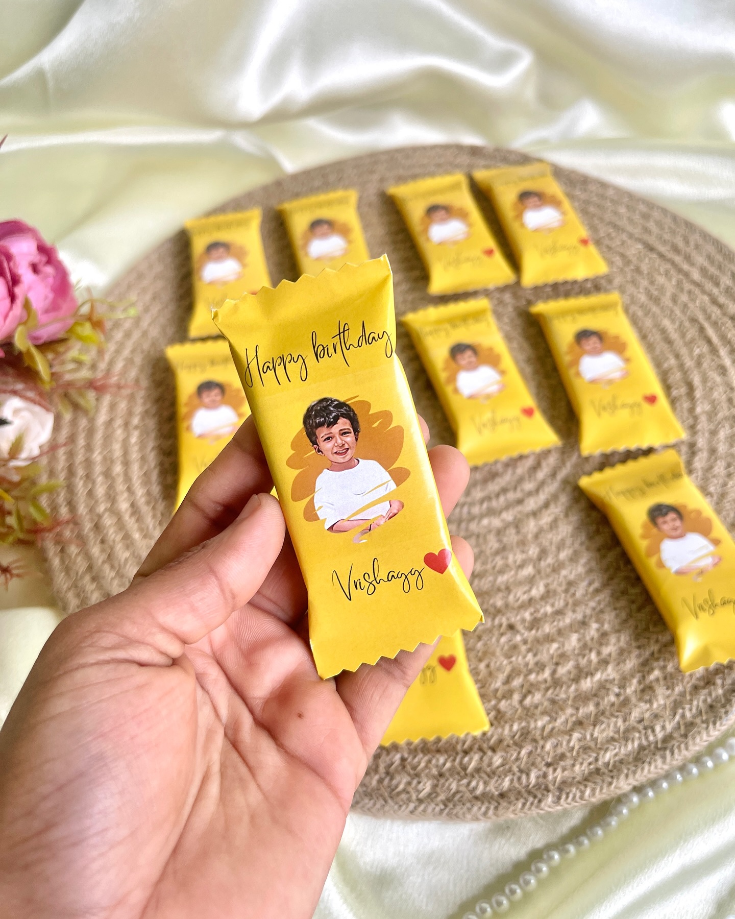 A set of individually wrapped chocolate bars printed with your child's photo and name for a sweet birthday celebration.