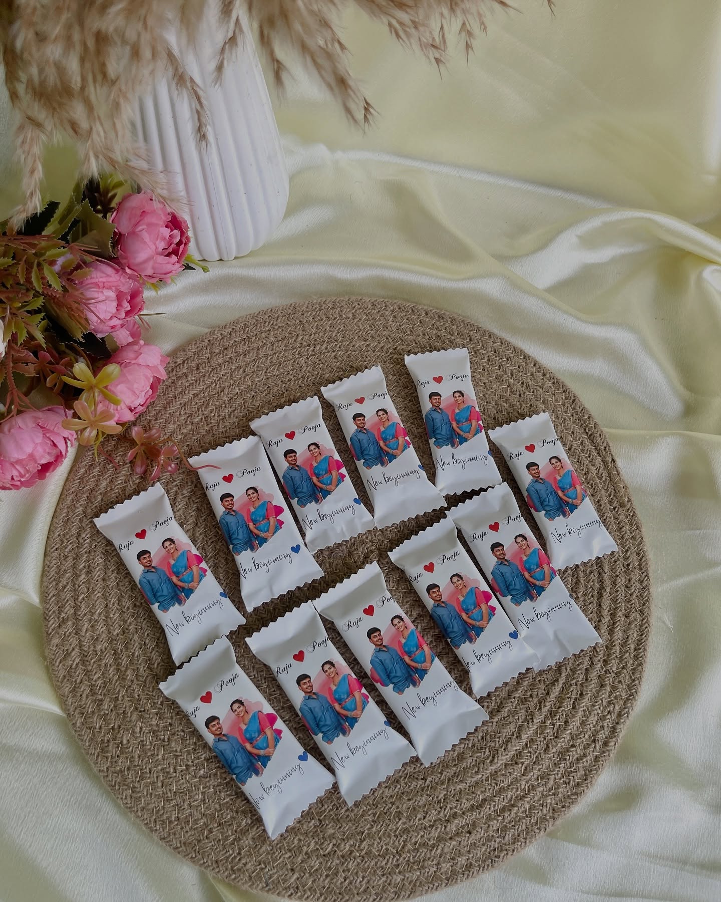 A set of individually wrapped chocolate bars printed with a couple's photo and names for a personal touch.