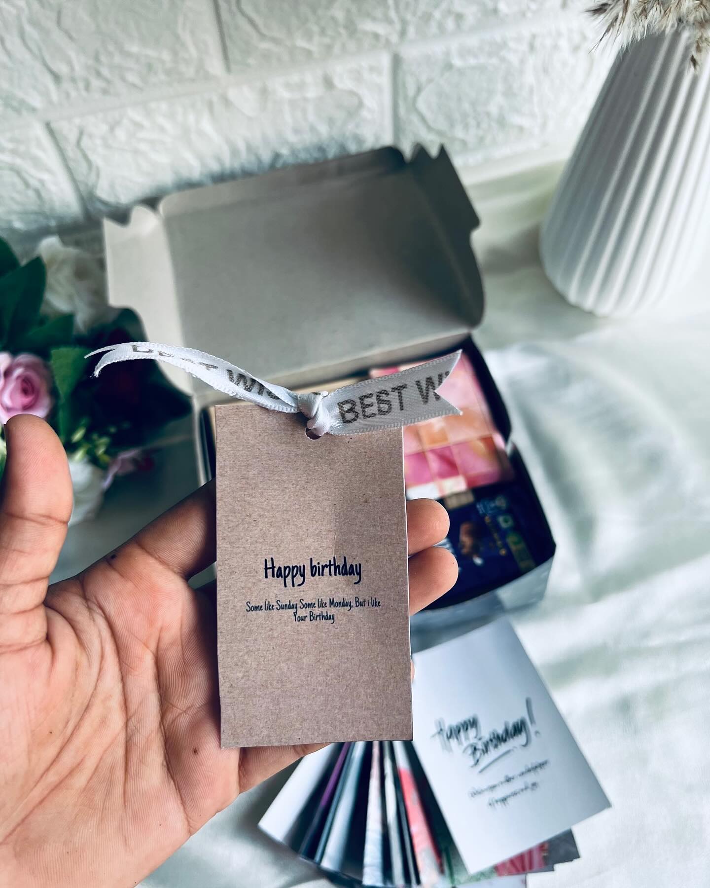 A mini ring-bound photo flip book of memories with a handwritten Happy Birthday message.