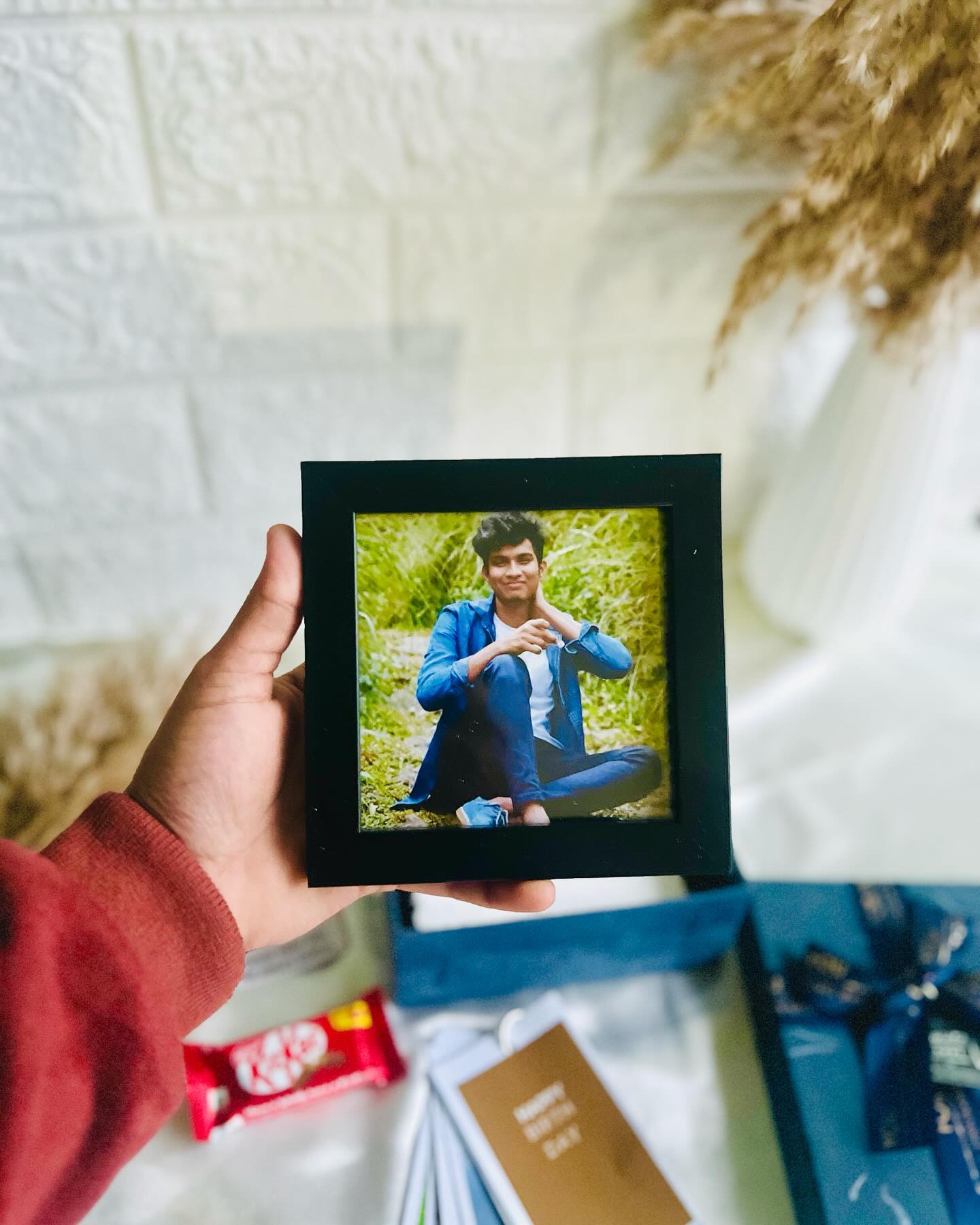 A custom mini photo frame paired with a KitKat bar and birthday cards, perfect for a thoughtful personal gift.