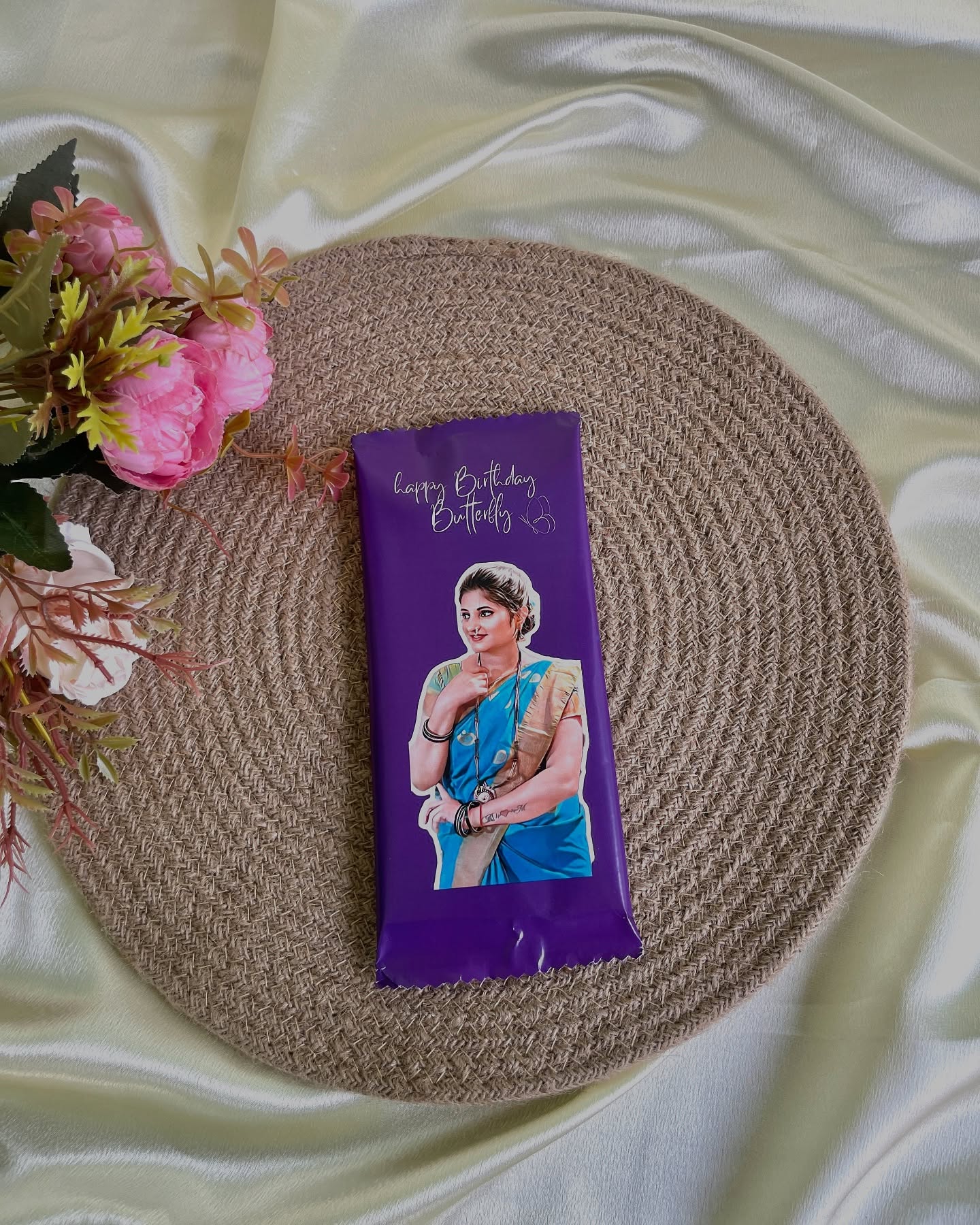 A giant chocolate bar wrapped in a custom photo print with a playful 'Happy Birthday' message.