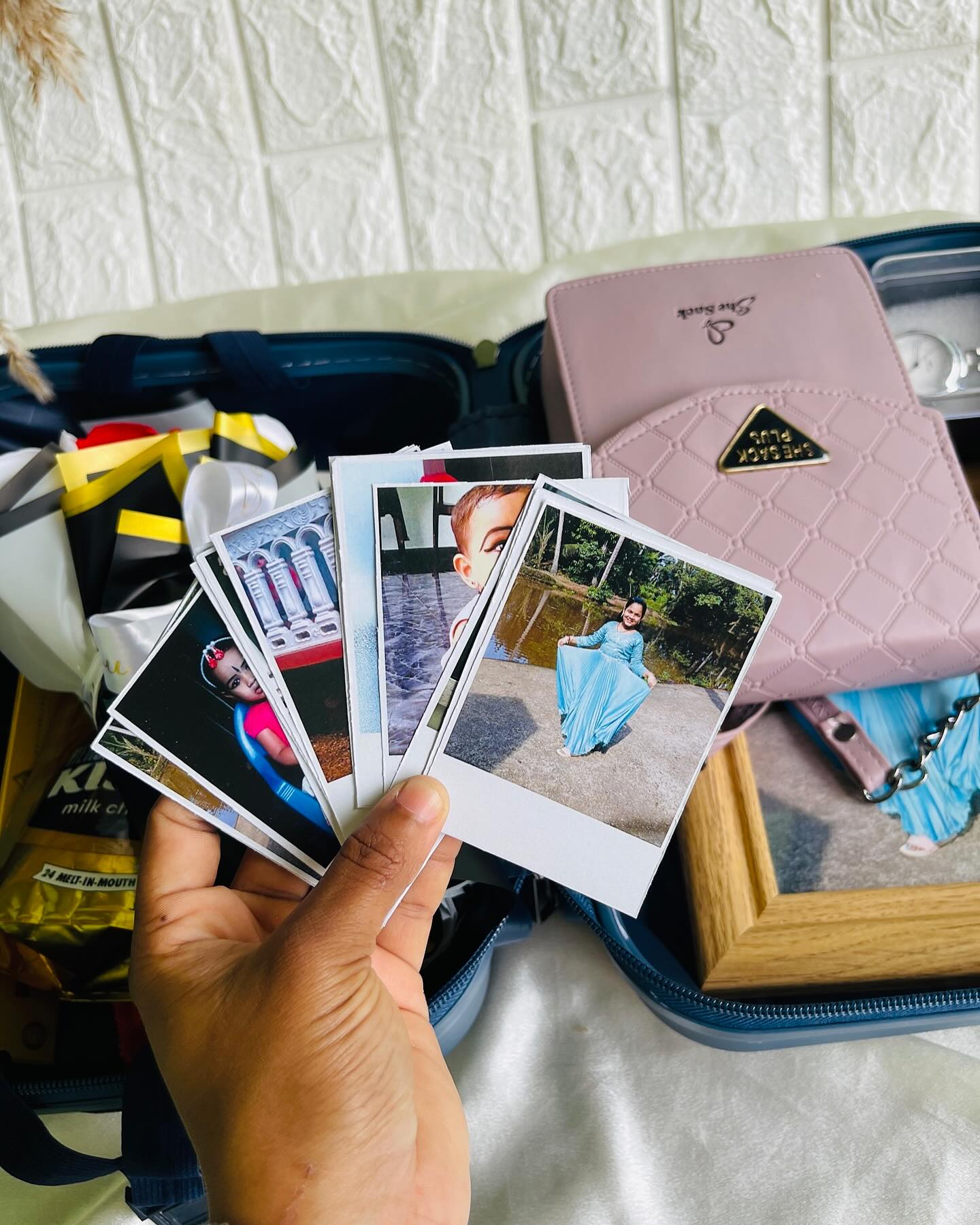 A curated fan of personalized polaroid-style photo prints for gifting cherished memories.