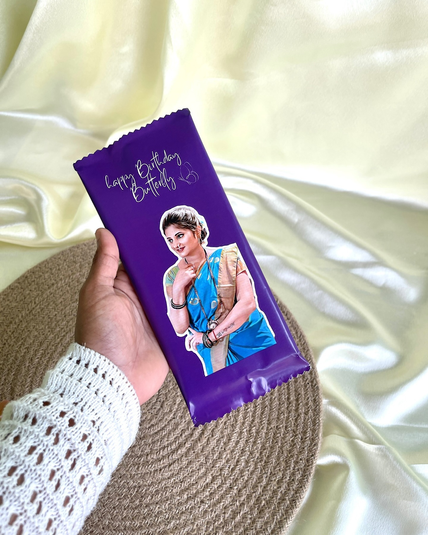 A personalized chocolate bar wrapped in a custom Happy Birthday Butterfly design featuring a printed photo of the birthday girl.